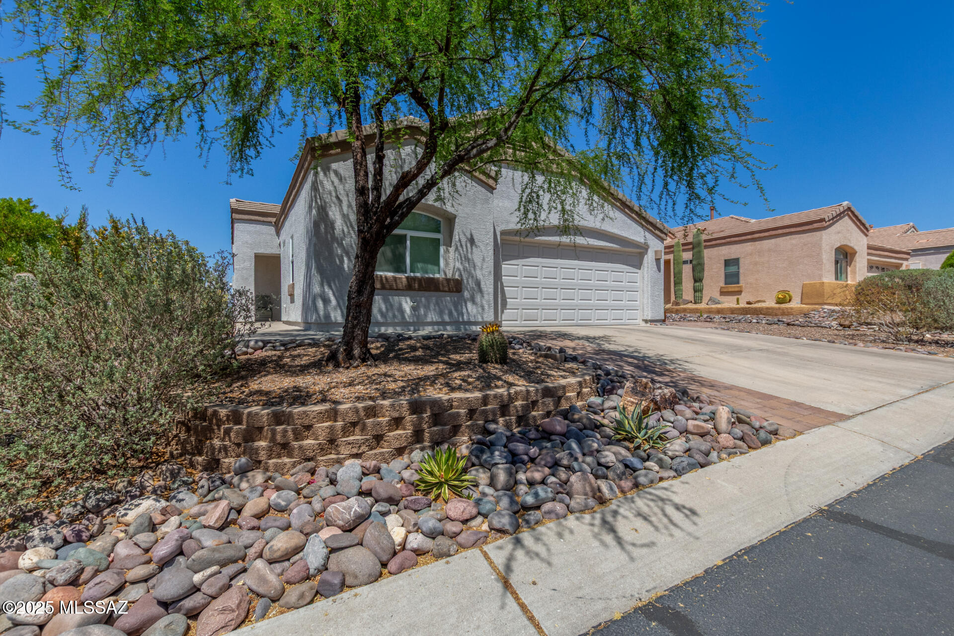 Welcome to one of the most stunning settings-breathtaking mountain and desert views steal the show. Enjoy peaceful mornings and vibrant sunsets from your great room's wall of glass or while relaxing in the beautifully updated screened Arizona Room. 3-bedroom, 2-bath home is filled with thoughtful upgrades throughout. Recent enhancements include New luxury flooring throughout (carpet in the primary bedroom), Lowered kitchen island with granite and Quartz countertops, modern backsplash, and new appliances, Updated lighting and stylish bathroom finishes including new shower in primary bath, quartz countertops, sinks, and toilets, New windows, HVAC system, water heater, washer & dryer, Fresh interior paint, updated garage door, attic flooring, and convenient pull-down steps in the garage and so much more. Step outside your door to explore miles of scenic hiking trails or take advantage of the vibrant amenities within the gated, active adult community: championship golf, pickleball, tennis, pool, spa, fitness center, restaurant, bar, and countless social clubs and events. Don't miss the full list of updates this home is move-in ready and ready for its new owner! Your desert sanctuary awaits!
