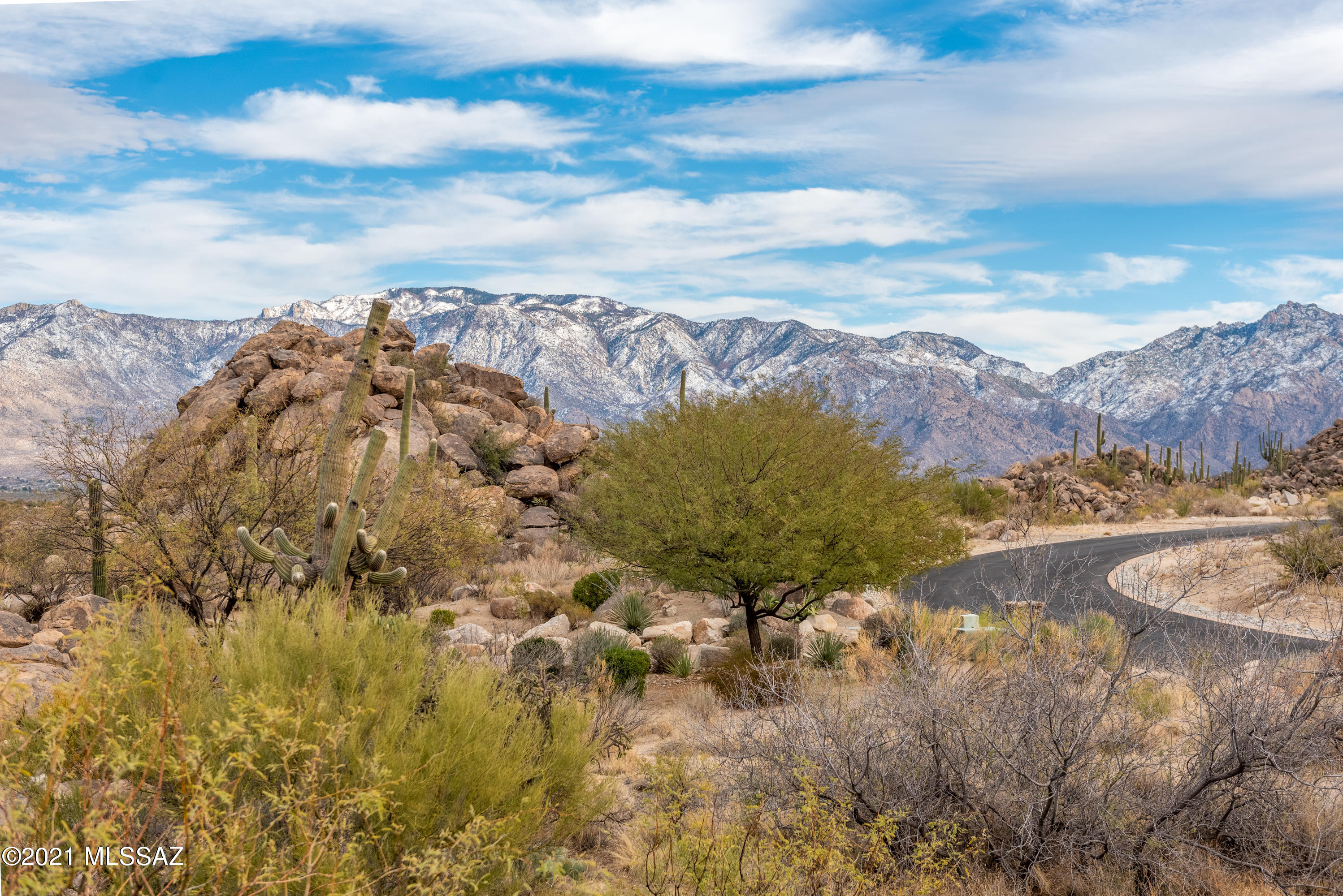 Nestled in the back of Stone Canyon, this lot embraces the serenity and the unique offerings of The Stone Canyon Golf Club Adjacent to hole number 7 on the top 100 nationally rated Phil Mickelson owned course, this 1.05 acre lot provides an easy building envelope.  Gorgeous rock outcroppings, views of the Santa Catalinas, Tortolita Mountains and 7th fairway, you get to design your best life in the unique beauty of the Sonoran Desert and the rare offerings of Stone Canyon.  Preliminary plans are available for separate purchase (and in final stages) if you desire a ready-made opportunity for a custom designed home capturing the privacy offered by the boulders while providing dramatic views of the adjacent mountains and golf course.  Alternatively, bring your own vision. The Stone Canyon Community offers a full clubhouse experience, golf, fitness, spa, tennis, pools, pickleball - all behind a 24/7 guard gated community.  The creme de la creme of living for the most meticulous of buyers.