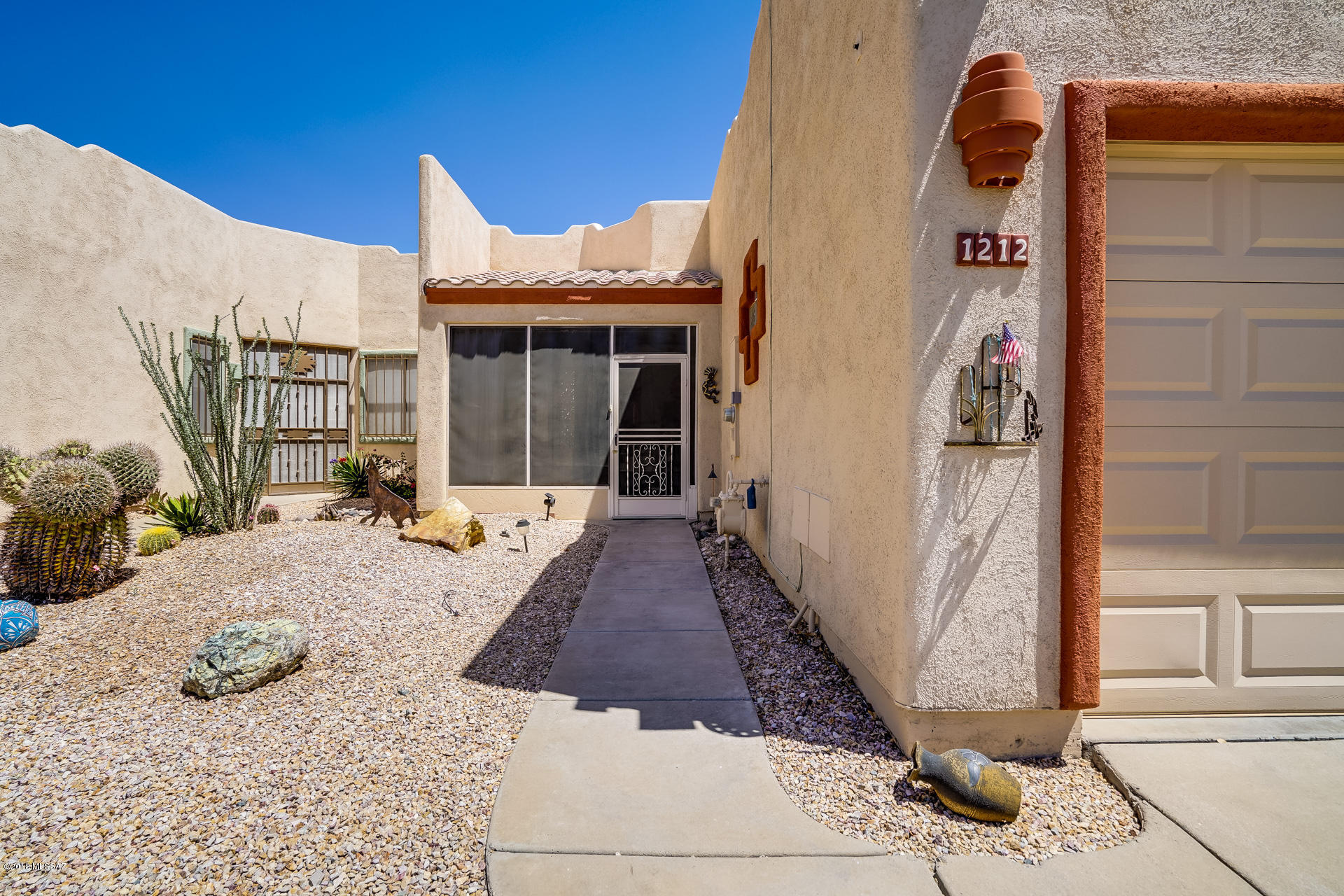 Your desert hideaway awaits! You will be drawn to the classic Southwestern architecture and red brick tile roof as you approach this 2 bedroom 2 bath fully furnished townhome. Enter through an inviting enclosed breezeway perfect for your morning coffee or socializing with friends. Inside you will find dark rich wood laminate flooring that compliments the Southwestern decor. Through the spacious living and dining area, you will come to your outdoor living space, complete with a large covered patio, fire pit, and lounge area perfect for entertaining! Retreat to your spacious master suite with a large walk-in closet. A guest room and full bath are located just down the hall. GVR is available if you choose, but not necessary with the beautiful neighbor clubhouse and activities. Welcome Home!
