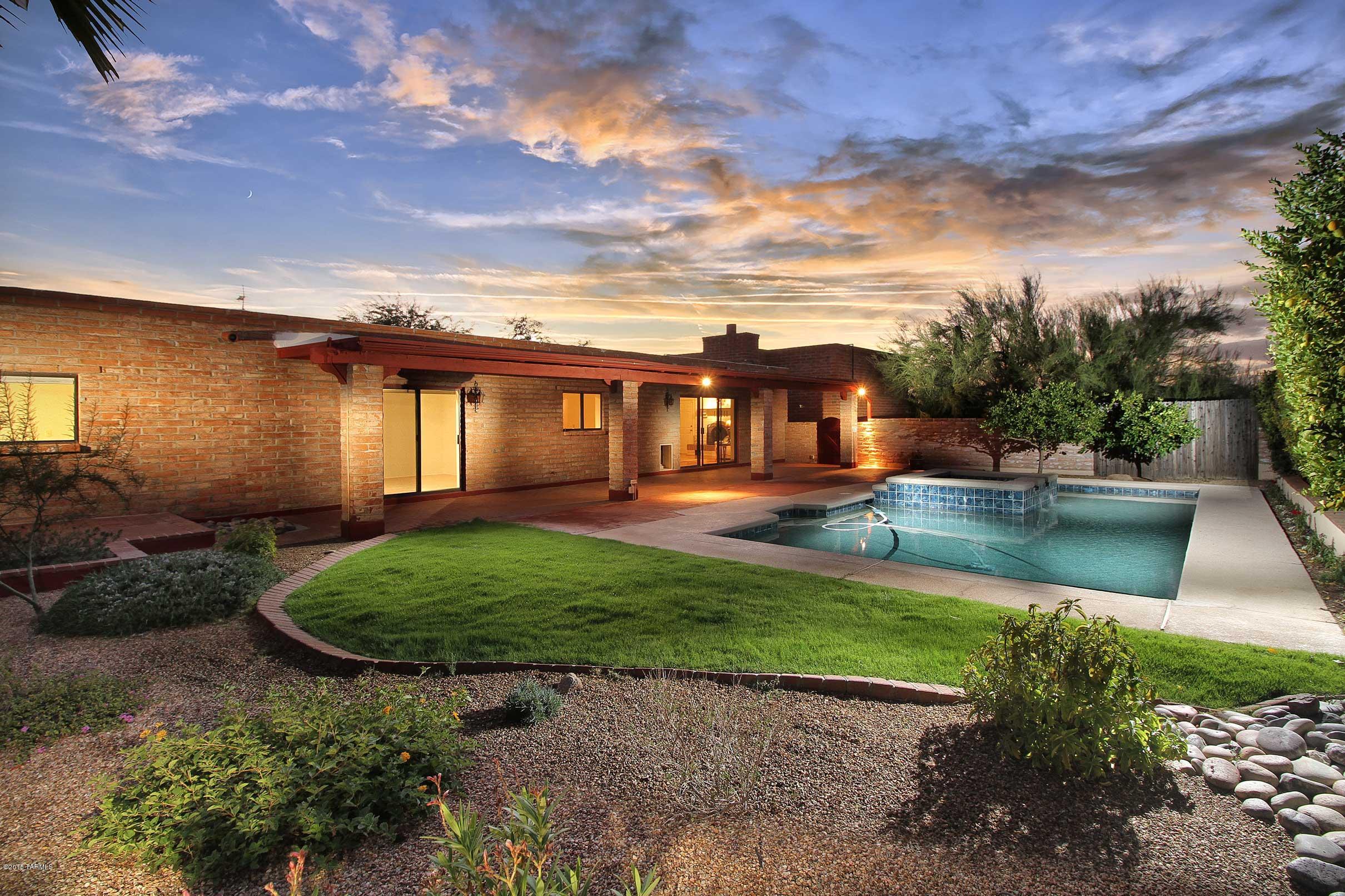 Come take a look at this magnificent one-of-a-kind home tucked away in the Catalina Foothills' highly desirable District 16.  This house sits on over an acre of property at the end of a quiet and calm, nature-filled cul de sac. Walking up to the property you will be greeted with a serene courtyard and abundance of mature and lush landscape. Saltillo tile and bright sun-filled rooms will capture you as you walk through this 3 bedroom, 3 bathroom home with more than enough space for a large family.  The large well-lit and open bonus room with separate bathroom and entrance is perfect for a home office, guest quarters or entertaining the whole family.  The lush, low-maintenance yard has a large pool with a relaxing water feature making this the perfect at home get-away. All of this just minutes from high-end dining, shopping, the La Encantada Mall and much, much more.