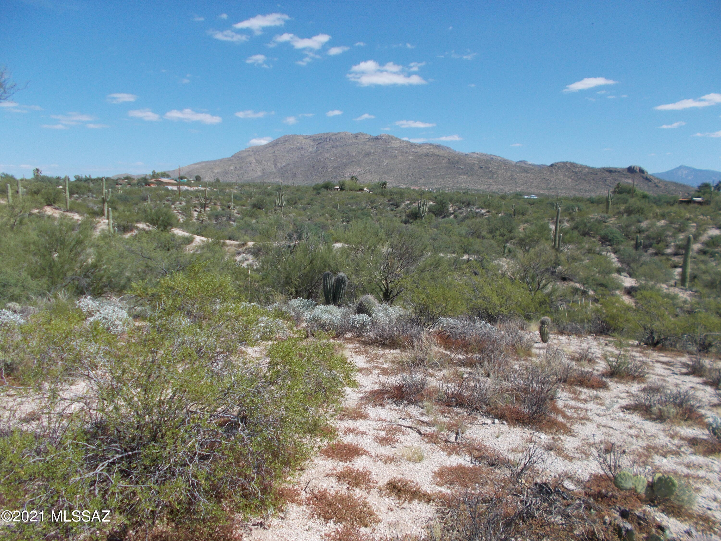 QUIET, PRIVATE, RURAL. 3.31 acres, FLAT, RIDGETOP parcel with BREATHTKING VIEWS of Rincon, Santa Rita and Tucson Mountain ranges. You'll also enjoy the Tucson valley lights at night from this HIGH, OVERLOOK parcel. Electric at neighboring property with TEP easement in place. Shared well with 2 neighboring homes with water line brought brought to north boundary. Choose a north south orientation with lots of room on this EAST BUILD SITE. Mature desert vegetation, SAGUAROS, PALO VERDES and more. Minutes to all the recreational options of SAGUARO NATIOAL PARK EAST. WITH no HOA or CCRs, award winning VAIL SCHOOLS, and PRICED at ONLY $130,000, make this a MUST SEE PROPERTY.