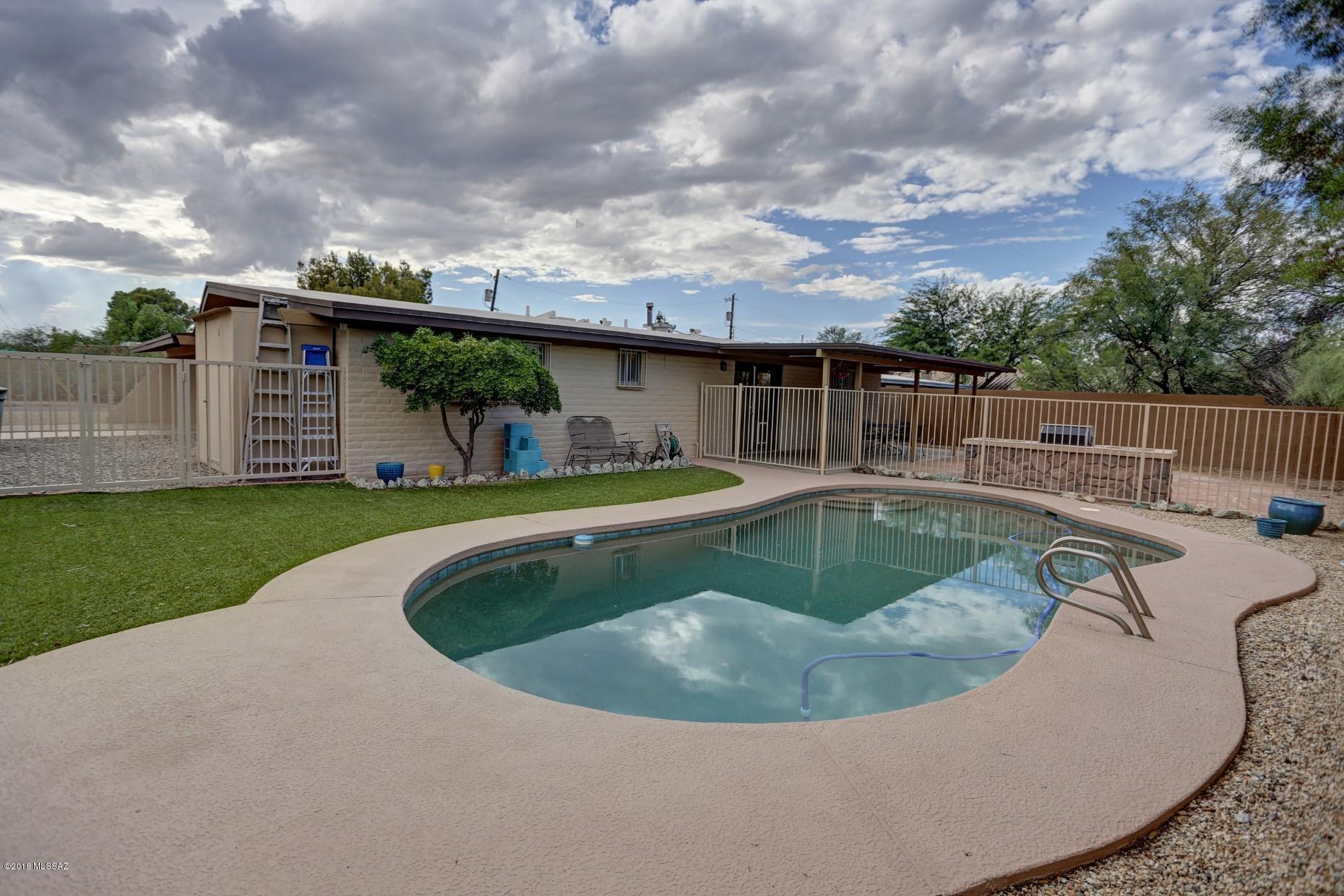 Motivated Sellers!!   You will not want to miss seeing this updated beauty! Centrally located, close to U of A, shopping, parks, dining and entertainment! Lots of upgrades like granite countertops, beautiful wood plank tile and cushy carpet in the bedrooms! You'll love the beautiful new split-tilt plantation shutters! Perfect for lots of natural light but allowing privacy. The sparkling pool was redone in 02/2018 and has a new pump/motor. Freshly painted inside and out with a large turf area and huge patio in the back, great for entertaining family and friends by the pool. Bonus large storage room off the carport!  Be sure to put this one at the top of your list!  Agent is related to seller.