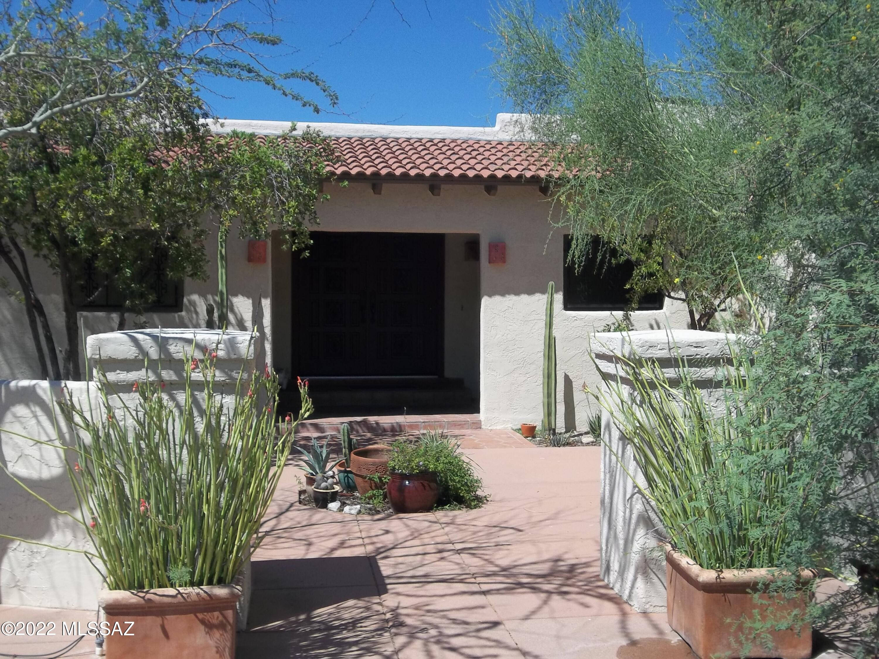 Enter on the long secluded driveway to this inviting private home in an open desert setting. This is a very comfortable 3 BR home with formal dining room. Great city and mountain views from large windows in living room and dining rooms. Remodeled kitchen with center island. Updated bathrooms have resort feeling, outside private shower. 2 beehive fire places warm the family and master bedrooms. 2 car garage with great lighting and 220 outlet. Very open desert setting all around this house. Show with confidence.
