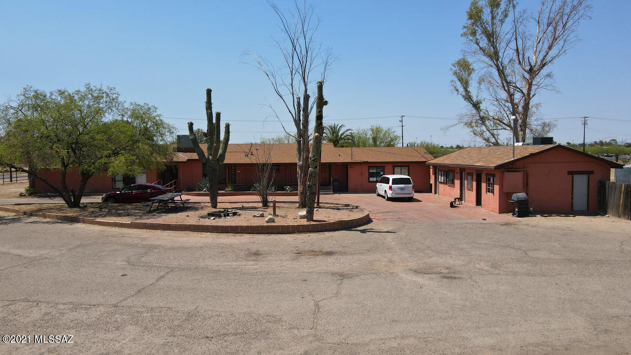 Over 20 acres in the heart of Tucson with lovely Catalina Mountain views! Fabulous location across from Brandi Fenton Park, this property includes 4 parcels, all zoned Pima-SR, allowing for multiple uses including residential, agriculture, assisted living, livestock, equestrian & more.Dreaming of a gentleman's farm? This could be the place! 15 minutes to U of A & 20 minutes to downtown plus easy access to Riverwalk/The Loop. Compound includes main house, guest house, office space, multiple outbuildings & tons of covered parking. This property has been used by Vision Quest for decades offering support to Tucson's youth. Call for an appointment to view this special property, the possibilities are endless!  Please don't disturb the tenants. ***Also listed in MLS as land (see MLS #22121679)