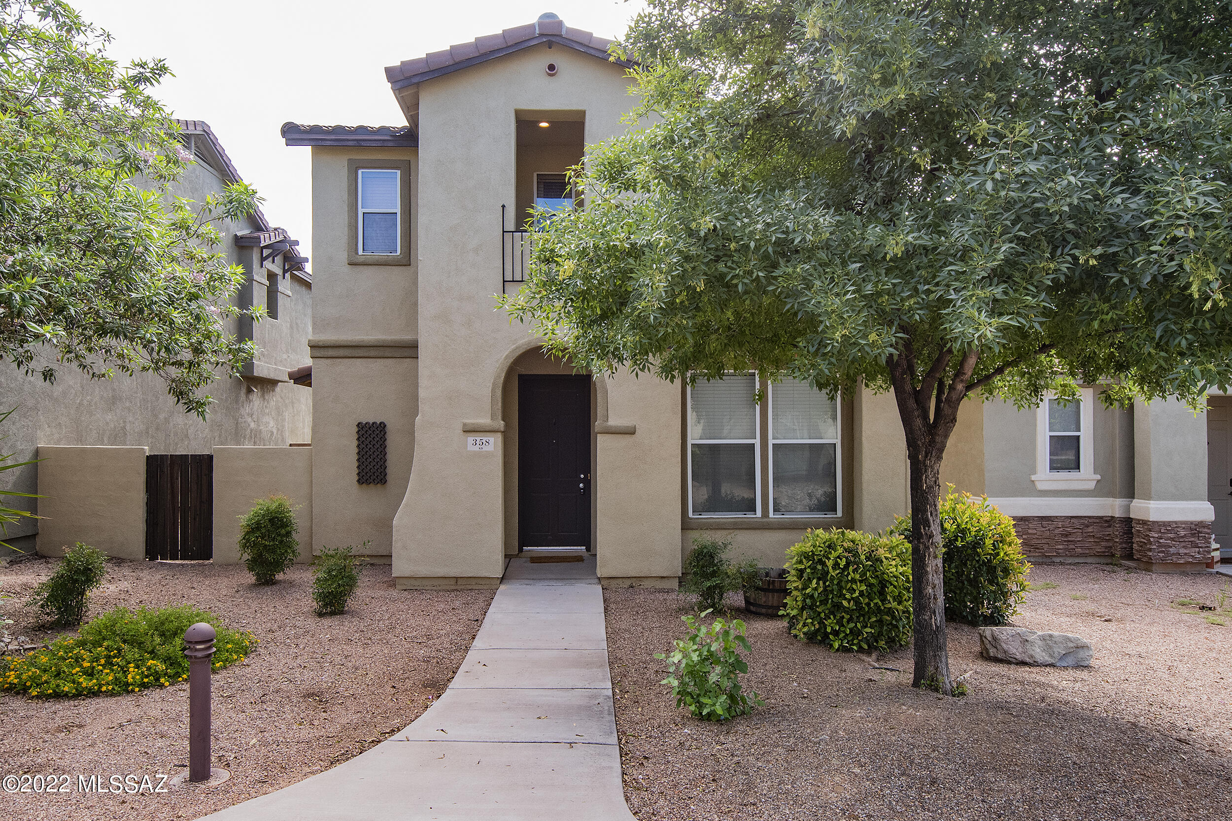 This beautiful California  Contemporary is loaded with lots of upgrades. The front yard opens onto a landscaped common area with trees and grass. Upon entering you walk into a spacious Great room that opens onto a gourmet kitchen with solid surface counter tops and all wood cabinetry. Also on the first floor is a bedroom with a full bath. Then upstairs are 3 additional bedrooms plus 2 full baths with a separate loft. Spacious master bedrooms with attached master bath. There is a covered patio off of the great room and fenced yard for kids or pets. also a 2 car attached garage.