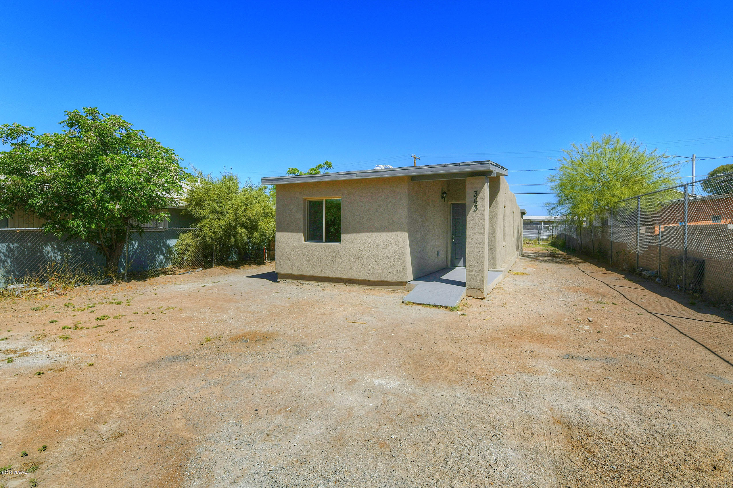 Must see beautiful cozy single family home! Located in south Tucson minutes away from I-10 , I-19 & Tucson Marketplace giving you access to family fun, shopping, restaurants & More! This charming home is a comfortable 1020 ft² and it was fully permitted with the City of South Tucson. Home has brand new AC unit that blows super cold air. Highlights include two tone paint inside and outside. Kitchen has been updated March 2019 with new cabinets and beautiful Formica counter tops. There is ceramic wood looking tile & new carpet in all bedrooms. Bathroom remodeled March 2019. New stainless steel appliances (Electric Range Stove, Microwave & Dishwasher) with an accepted offer. Don't miss out on such a stunning, turn key home!