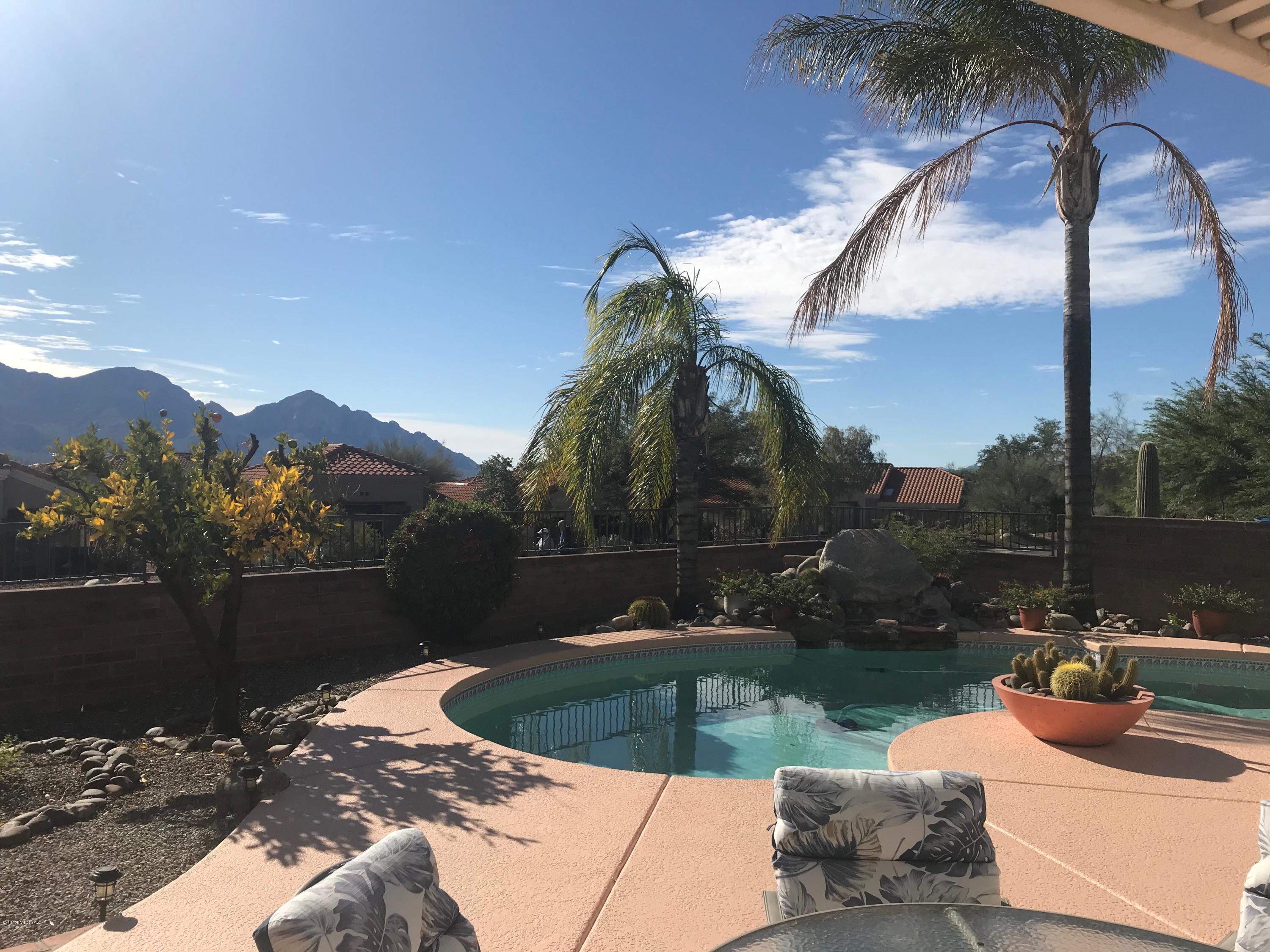 Beautiful Mountain Views! This meticulously maintained 3 bed 2 bath sits on a premium corner lot. Enjoy the views of the Catalina mountain from your personal pool or from one of the two covered patios. There are mature citrus trees and a fig tree in the yard as well! The kitchen has been updated with new cabinets. Corian counter tops and stainless appliances. There is tile throughout the common areas and beautiful wood laminate in the bedrooms. There is plentiful storage in this home and the Train HVAC system was installed approximately 9 years ago. This home is one of Sun City Rancho Vistoso finest. Air cleaner in the hallway.