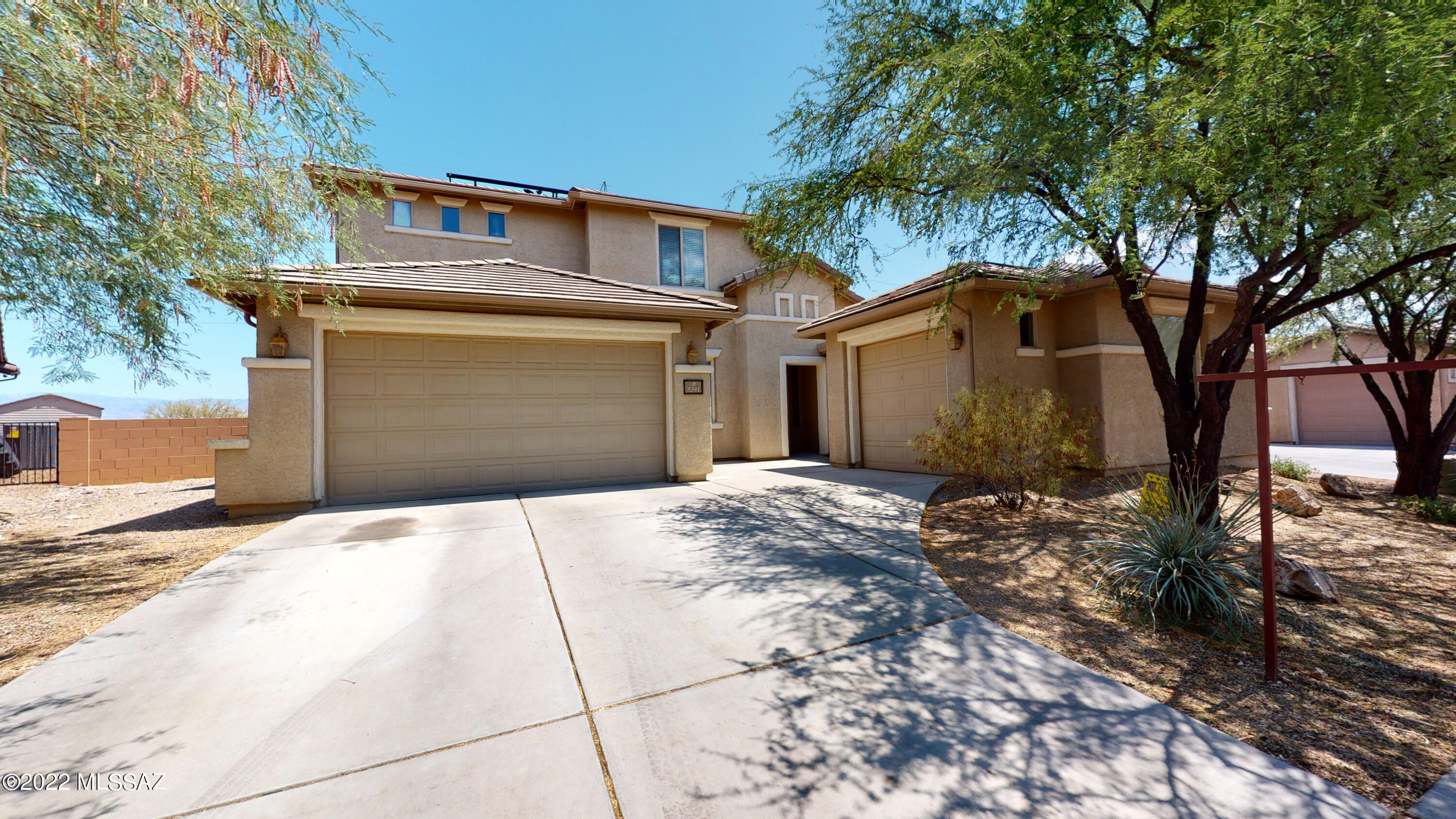 With more than 3,000 square feet on a premium lot located in the highly desirable Sierra Morado community and the coveted Vail School District, you'll love this quality-built Pulte home. The large, open great room has soaring ceilings with windows that show off the amazing views of the Rincon and Catalina mountains and a stacked stone fireplace.  The northeast-facing yard has view fencing backing to the Civano wash with natural desert.  The porch runs ¾ of the length of the home and includes a natural gas stub for a BBQ grill and plenty of shade for entertaining.  Downstairs you will find a formal living and dining area that leads to a luxurious kitchen with granite counters, a center island, and an enormous pantry. The downstairs master suite features a bay window.  The office space could easily be transformed into a 5th bedroom with the addition of a closet.  Upstairs you will find an extraordinary loft that offers flexible space perfect for a home theater, teen room, or game room as well as the final three bedrooms and bathroom.  The spacious three-car garage along with a mudroom that includes a utility sink makes this a home that meets all of your needs. Pride of ownership abounds in this original owner home.  Sierra Morado amenities include a community center with kitchen and meeting rooms, a community pool with beach entry, lap pool, 13 parks, 4-mile integrated trail system, 2 basketball courts, and minutes from Tucson's Fantasy Island Mountain Biking Trail.  Come see this gorgeous home today!
