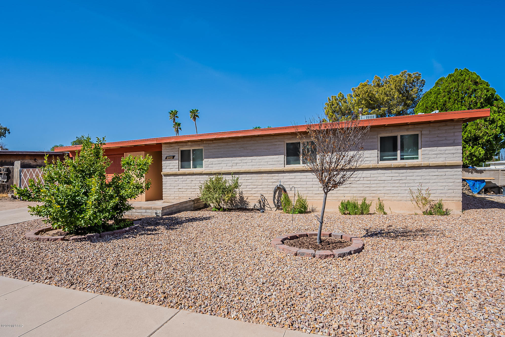 Well maintained 4 bedroom, 2 bath home on the Eastside. There's plenty of versatility with two RV gates and a detached garage/workshop, in addition to the single, extended garage. Large backyard with plenty of space to play.  Inside, the flooring has been updated to upgraded tile throughout most of the home.  Kitchen has generous counter space and cabinets.  Gorgeous fireplace is the focal point of the den/dining room and living room areas.