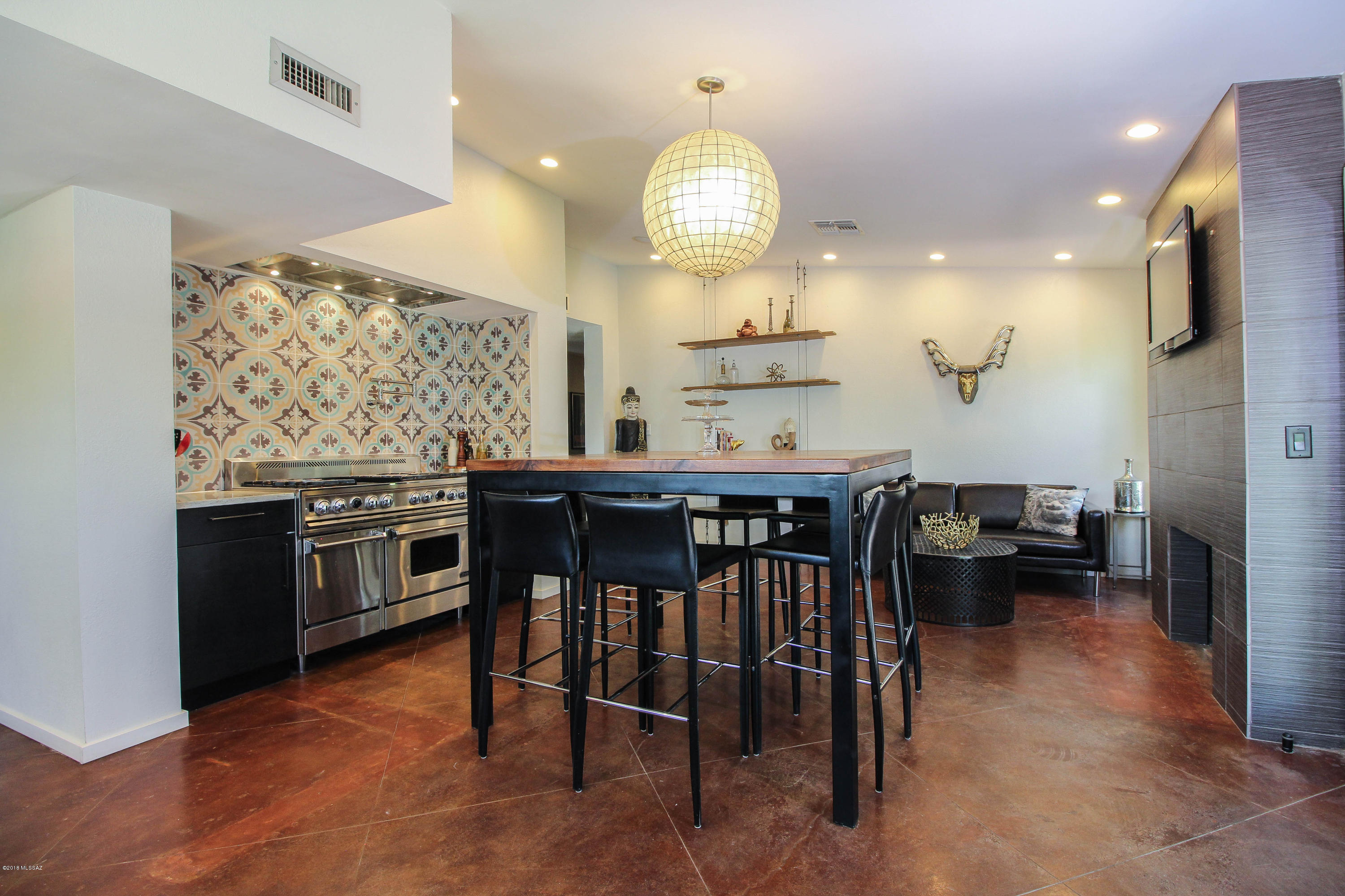 Seller will entertain or counter offers between $299,900 and $314,900. Entertainers Paradise! This home will be perfect for all of your entertaining needs. Resort style backyard has a built in bbq, custom gas lit fire pits, outdoor Edison lighting, natural grass and mature trees for shade and privacy. Kitchen is a chef's dream with a custom chef's cook-top, hand painted tile back splash, soft closing cabinets, custom fixtures, and a built in stainless steel refrigerator. This home is in an established Sabino Canyon neighborhood with amazing views and close to shopping, schools and entertainment. You need to see this home to experience everything it has to offer.