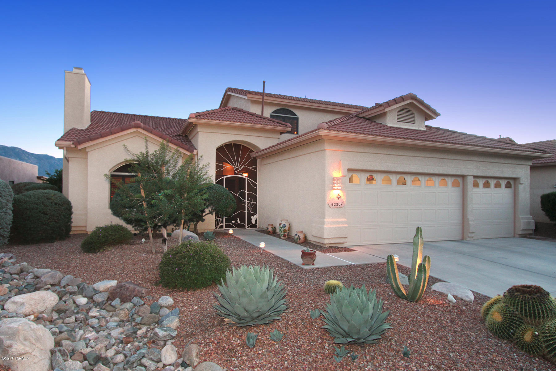 SUNRISE, SUNSET, SUNRISE, SUNSET, sweeping across your glorious views of the mountains as you enjoy your morning coffee or evening delight from the wide brick patio. This warm and inviting SaddleBrooke charmer (Durango model) has been upgraded in the past year with over $18,000 of improvements, including two new AC/Heating units ($11,500), new refrigerator ($1800), new microwave + convection oven ($2500), new stovetop ($900), new dishwasher ($650) and a new washer dryer ($1000), and is ready for its new owner. From the front door, enter into a welcoming foyer with a cozy library/office to one side and a gracious living and dining room centered on a lovely traditional fireplace with a marble surround and hearth. Plantation shutters beautifully grace the living and dining areas. The spacious and updated kitchen, breakfast area and great room has oodles of room to prepare and serve a feast while enjoying the spectacular views and sharing in the activities of family and guests in the adjacent great room. The generous master bedroom, with a bay window that continues the panoramic mountain views, adjoins the large master bath with jetted tub, private enclosed commode and sizable walk-in closet. The convenient over-sized laundry room includes a sink and generous counter space along with the new washer/dryer, Upstairs are guest quarters featuring two comfortable bedrooms and a full bath. It's all painted in lovely Southwestern tones and ready for you to settle in. As a bonus, this home includes a three-car garage. This delightful dwelling is located in a very friendly, sociable neighborhood! Come on over and join the fun. Even more fun is the recent fabulous price reduction!