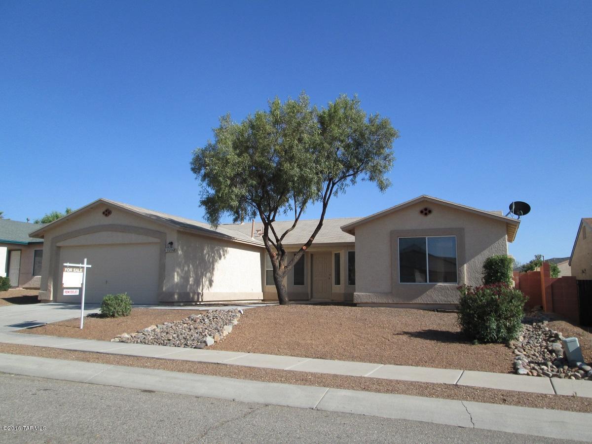 Seller will accept or counter offers from 209,900 to 219,000. Remodeled, move in ready 2,180 square foot, 4 bedroom, 2 bath home in the Vail School District. Plenty of room for everyone. Open, split bedroom floor plan with vaulted ceilings, family room, living room, dining area. Spacious kitchen that's open to the living area, new stainless gas range, dishwasher, microwave, sink, faucet, + more. Entire home has new carpet and diagonal tile, new 6 panel interior doors with new hardware. The master bath features a garden tub and separate shower with dual sinks raised to executive height, ALL new- ceiling fans, door hardware, lighting fixtures, sinks, faucets, even the toilets are new. The exterior & interior have been painted. Tastefully landscaped, south facing backyard, covered patio.
