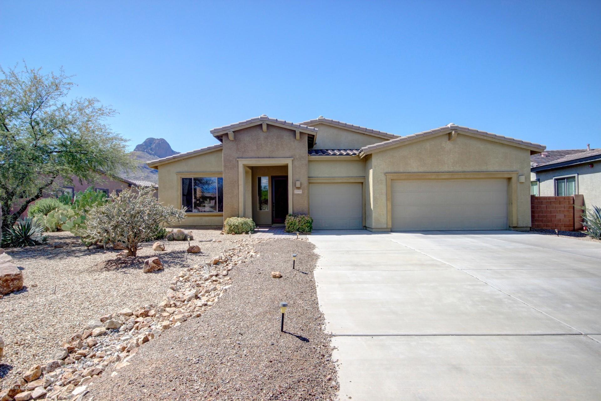 IMMACULATELY maintained 5BR/3BA home in highly desirable GATED community of Ironwood Reserve! Beautiful contemporary home with freshly painted exterior sits on an oversized .34 acre lot backing up to Sombrero Peak to provide unobstructed mountain views from backyard & rear windows throughout home. Gourmet kitchen w/granite countertops, SS appliances, 42'' wood cabinetry & double ovens. Home also features extensive tile, 8 foot doors, custom wood window coverings, upgraded lighting hardware & plumbing fixtures throughout. Spacious living/dining room & family room w/cozy gas fireplace. High ceilings & split-floor plan. 3.5 car tandem garage provides plenty of space for trucks/SUV's w/many options for storage and/or work space. Covered rear patio looks to scenic desert landscape backdrop.