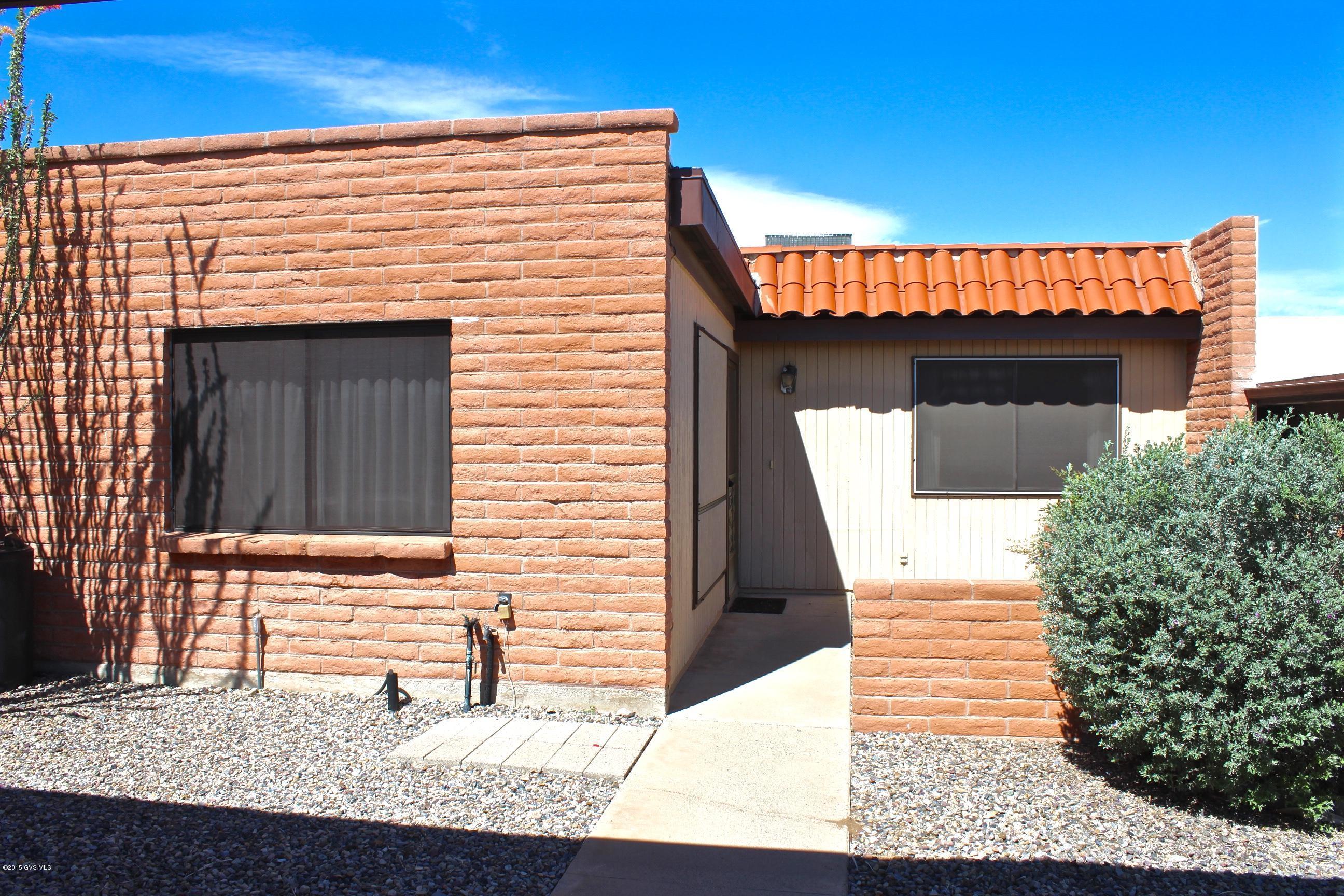 Be delighted as you sit out on your front patio! Soak in the early morning sunshine & beautiful mountain views! Whether you are seasonal or living all year round, this home will meet your needs! Nicely updated townhouse has new flooring, new oven/range, fresh coat of paint inside, & pull out shelves!! The Arizona room offers plenty of space for dining or ideal for an office! Pleasant back yard has views of common areas & allows for privacy. GVR amenities offer over 60 clubs and activity work shops. Rec center, shopping, churches, American Legion, & library all close by! Walking distance to the community pool & shuffle board. HVAC replaced a few years ago. In good clean condition! 2 carport spaces. Meet friendly neighbors that have fun gatherings!