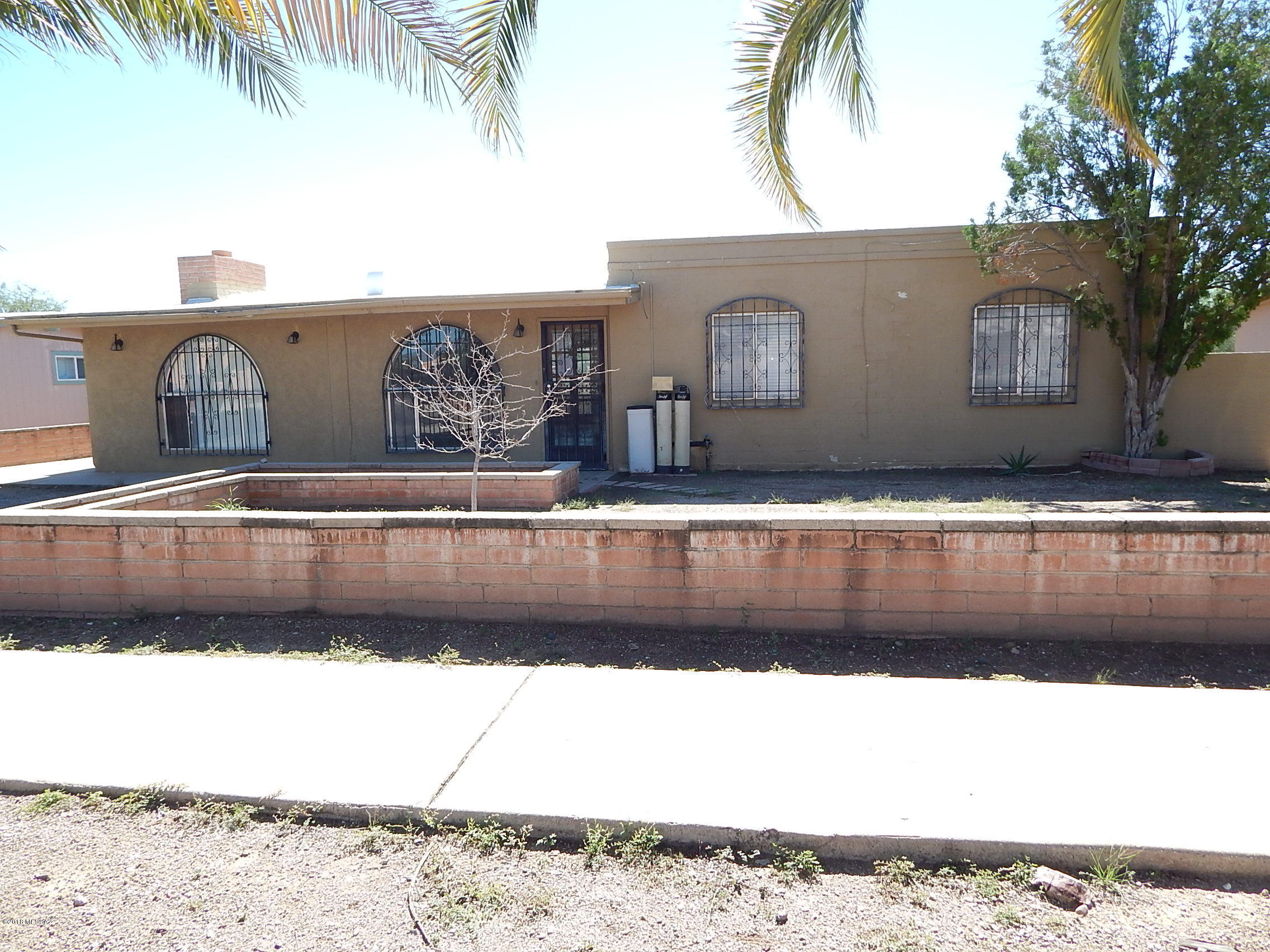 Look at the tremendous potential with this charming three bedroom house! Arched door way, huge brick fireplace, french doors and a big kitchen just screaming to be updated. Good flip potential with this fixer. Good bones, large lot.