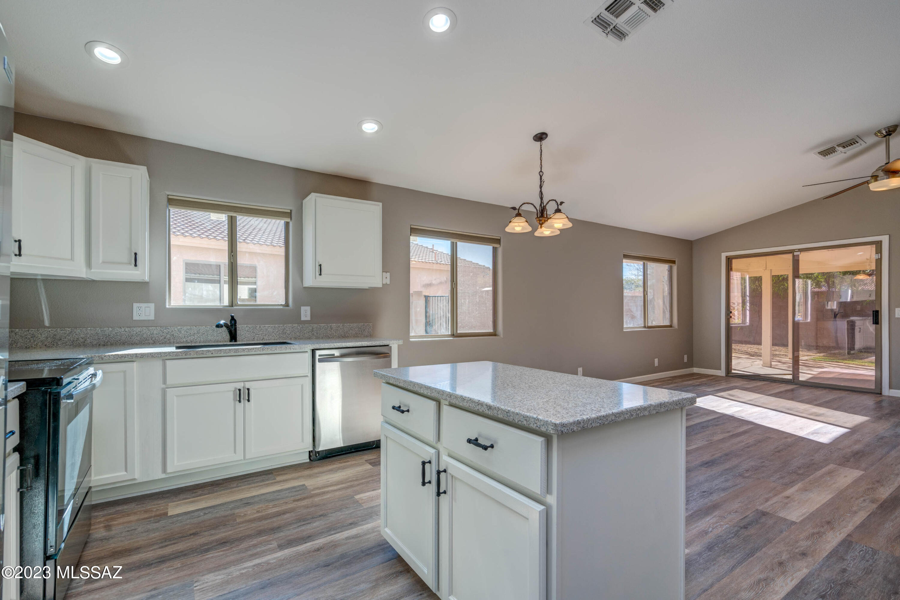 Range Pricing: Seller will accept/counter offers between $335,000 and $344,000. W/Accepted Offer prior to 03/10/2023 New Washer & Dryer included! Seller Concessions Considered. Spacious, Open Floor Plan. Freshly Painted Inside and Out! New Luxury Vinyl Plank Flooring throughout! Walk in to Beautiful Large Living Room w/Dining Area. Bright Kitchen w/Island opens to Family Room w/room for Kitchen Table if you choose. Sliding Glass Doors for ease of access to Backyard w/ nice size Covered Patio, Fruit Tree's and Artificial Turf. Owners Suite features Walk-in-Closet, Separate Tub & Shower plus Double Sink Vanity. 2 more nice size Bedrooms and Hall Bathroom w/Tub-Shower combination. Dedicated Laundry Room and 2 Car Garage! Light, Bright, Clean & Fresh. Move in ready, Welcome Home