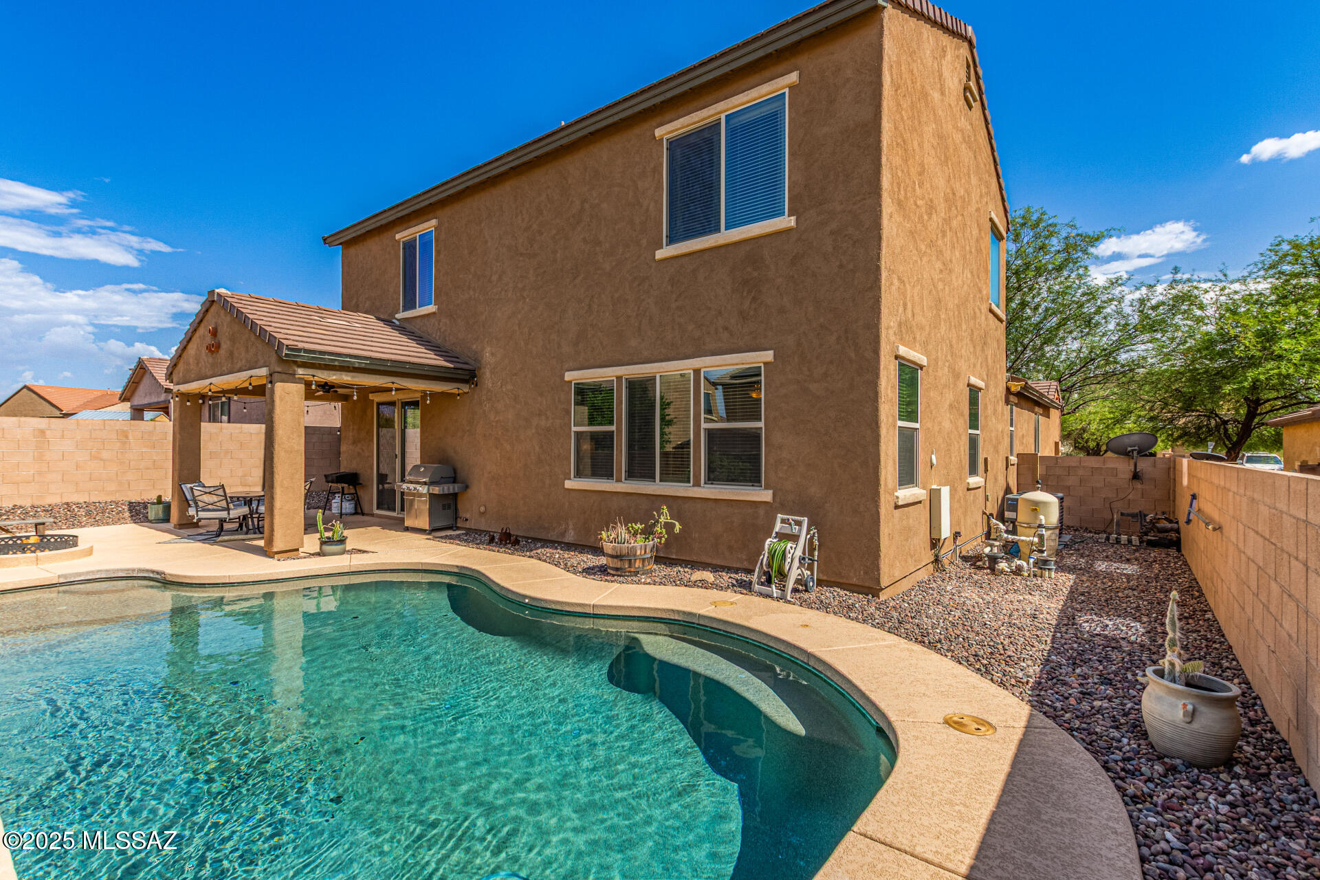 Coming Soon! Beautifully maintained 2-story home in the desirable Oasis Santa Rita community. This 2,400 sq ft home features 4 spacious bedrooms, a versatile bonus room, and 2.5 baths. Situated on a 6,447 sq ft lot, the backyard is an entertainer's dream with a sparkling saltwater pool and outdoor fire pit, perfect for relaxing or hosting gatherings. The well designed floor plan offers open living spaces and functional flexibility. Located in the sought after Vail School District, this home offers the perfect combination of comfort, style, and location. Don't miss this opportunity!