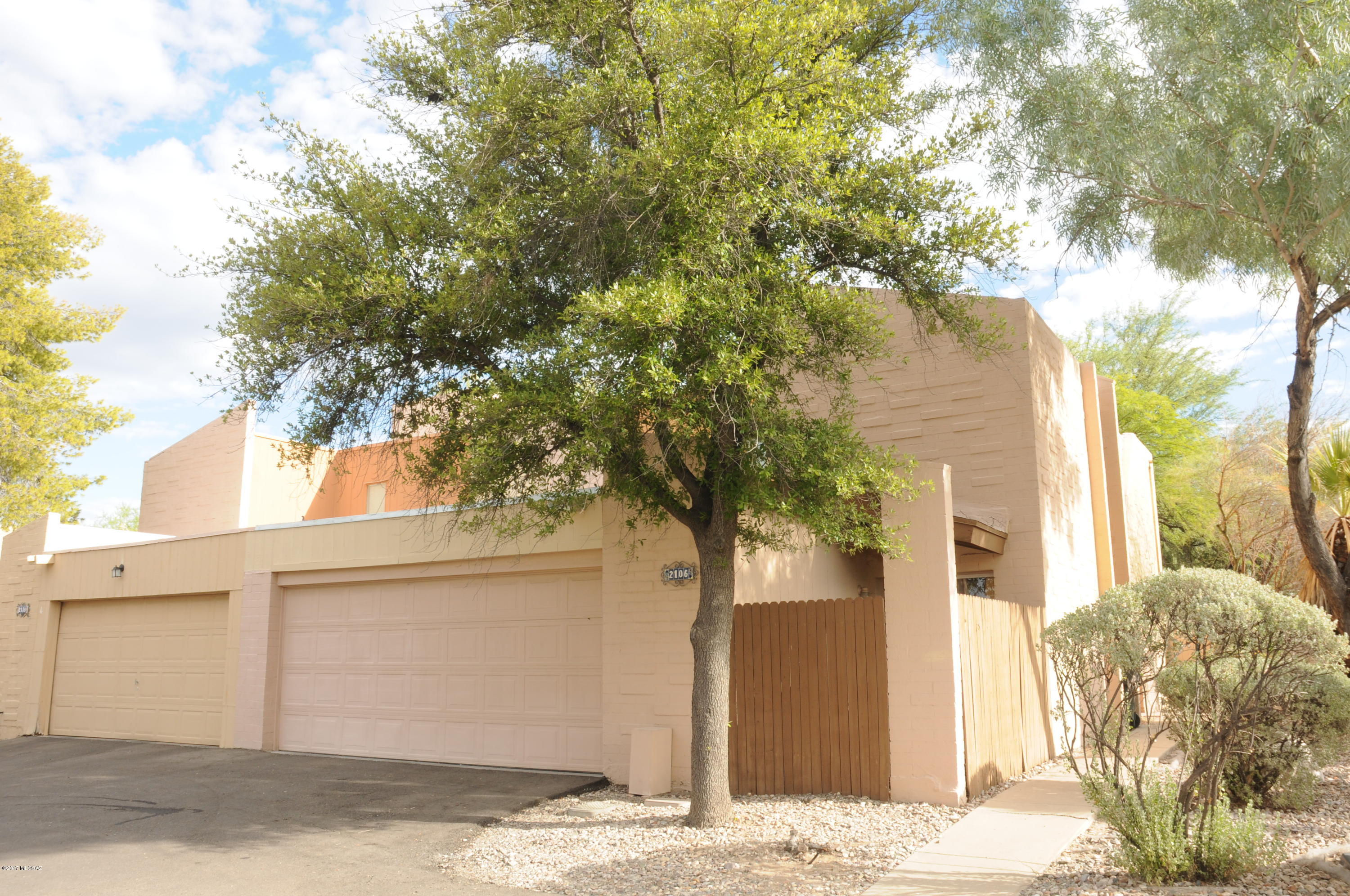 Beautiful and very well maintained Townhouse in wonderful community. Very quiet, no through traffic. High ceilings, wood floors, two French doors lead to large and very private backyard. All appliances stay! Very open and bright. Balcony off of one guest room. Community offers pool, basketball & tennis courts. Close to shopping, restaurants and Udall Park. Move in ready. This is a very nice home!!