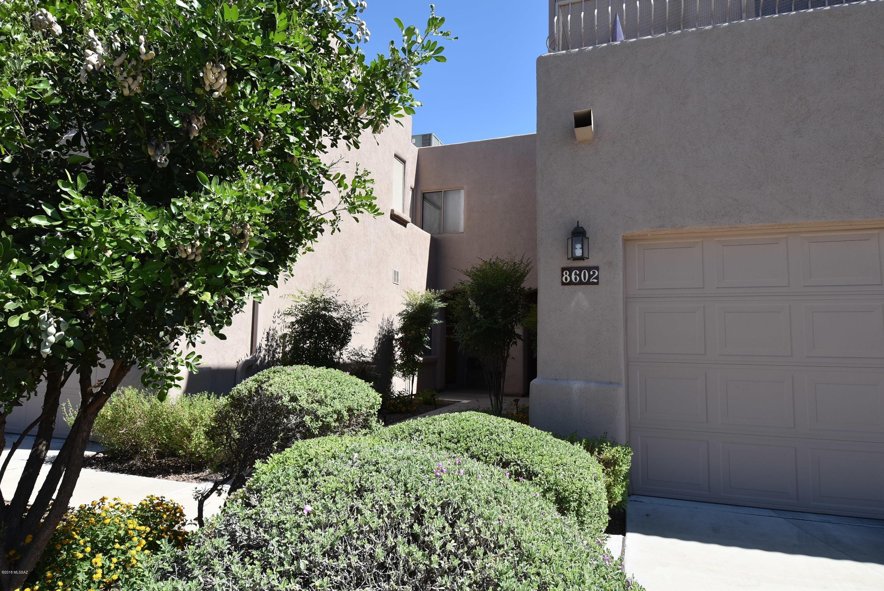 Beautiful eastside executive townhome in gated community. Spacious floorplan with 1910 SQ.FT.,open and bright featuring 3 bedrooms+den,3 full baths & 2 car garage. Oversized master suite with walk-in closet,master bath with separate shower & garden tub,balcony with stunning Catalina Mountain views & separate bonus area perfect for sitting area,second study,crafts, etc. Great room with towering ceilings. Open kitchen with lots of counter space,stainless appliances,breakfast bar, & pantry closet. Private rear patio with extended roof provides outdoor space to relax with morning coffee or entertain friends after dinner. Laundry room with washer & dryer leads to 2 car garage. 1 year minimum lease. Non-smoking home. Renters insurance required. Subject to application process and credit approval.