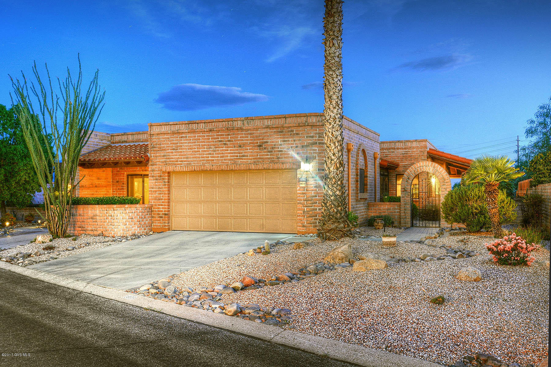 Gorgeous views from the bricked wrap-around patio of this very special home! 2050 sq ft consists of 2 bed/2 bath + den. Warm tile flows from the elegant entry throughout most of the living areas. The spacious living room will welcome guests with its custom gas fireplace and sliders letting in all of the natural light. The spacious and bright dining area is adjacent to the living room & looks out onto those spectacular Santa Rita Mountains! The updated kitchen showcases custom maple cabinets with soft close doors & pullouts. The den has a wall of built ins for art display or office and craft work, and is large enough to double as a third guest room.The master suite is luxurious with sliders leading to the patio, a huge garden tub, double vanities and walk in close The guest suite offers privacy and comfort with its own patio and peaceful garden area.This home is truly your oasis in the desert!