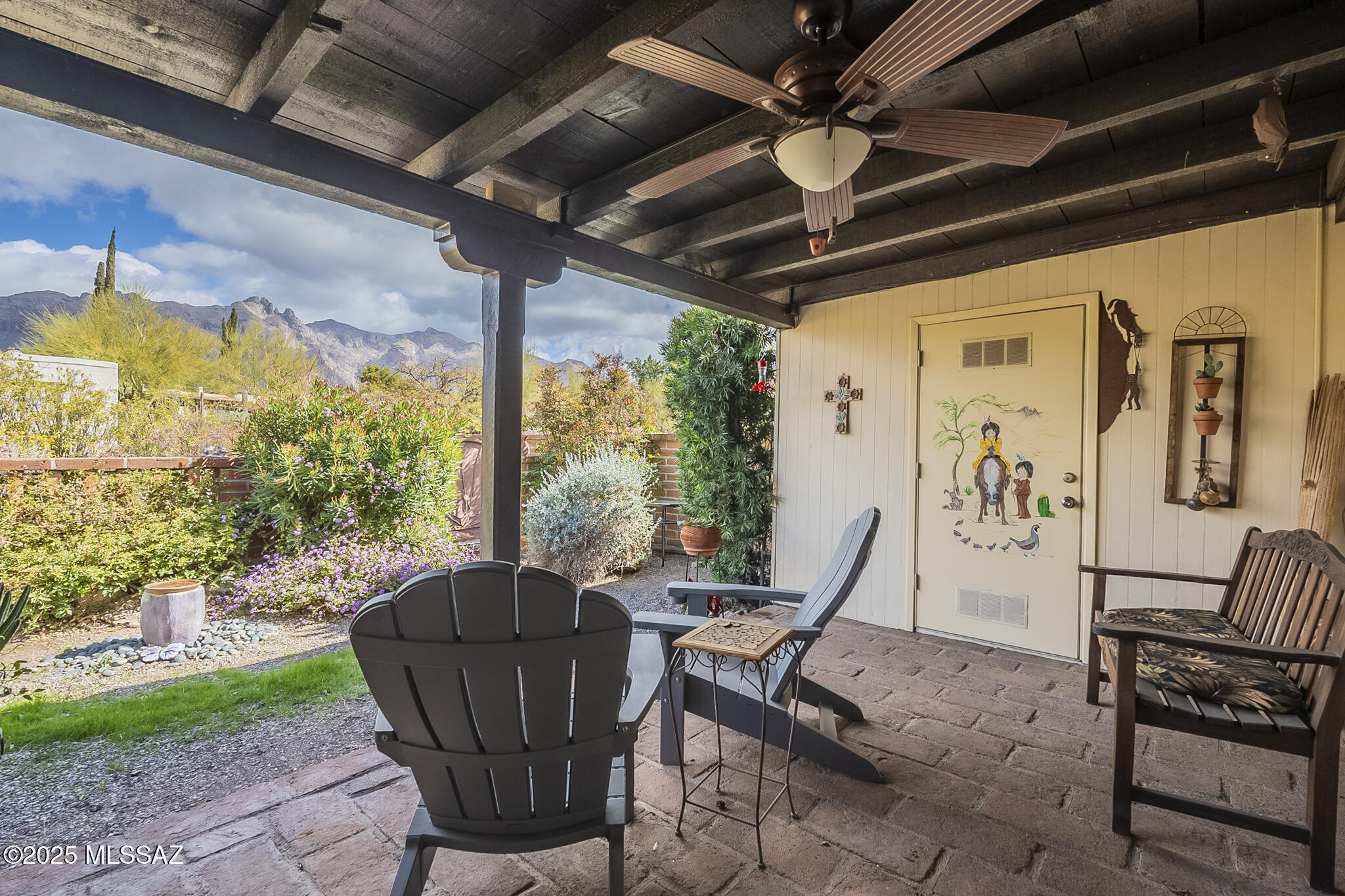 This great location across the street from La Encantada includes 3 swimming pools and 1 hot tub spa! The views from the back patio are stunning and include Finger Rock, the Santa Catalina Mountains and sunrises. Front yard is graced with slate stone patio, native bushes and a mature Saguaro cactus while back patio and back fence are adobe stone (with outside storage closet on back patio).  This is one of the few homes with a 2-car garage (washer/dryer in the first garage closet plus two additional closets on side wall). Expect the best in this 2 bedroom, 2 bath house: Corian counter tops in the kitchen, 2024 HVAC, remodeled secondary bathroom, Pella double-paned windows throughout, sliding glass 3-panel door, & ceiling fans throughout.