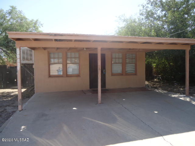 1 of 8 units and this was the original building of the property.  This unit has 1 bedroom and 1 bath with a shower in one room and tub in another. Has a carport.