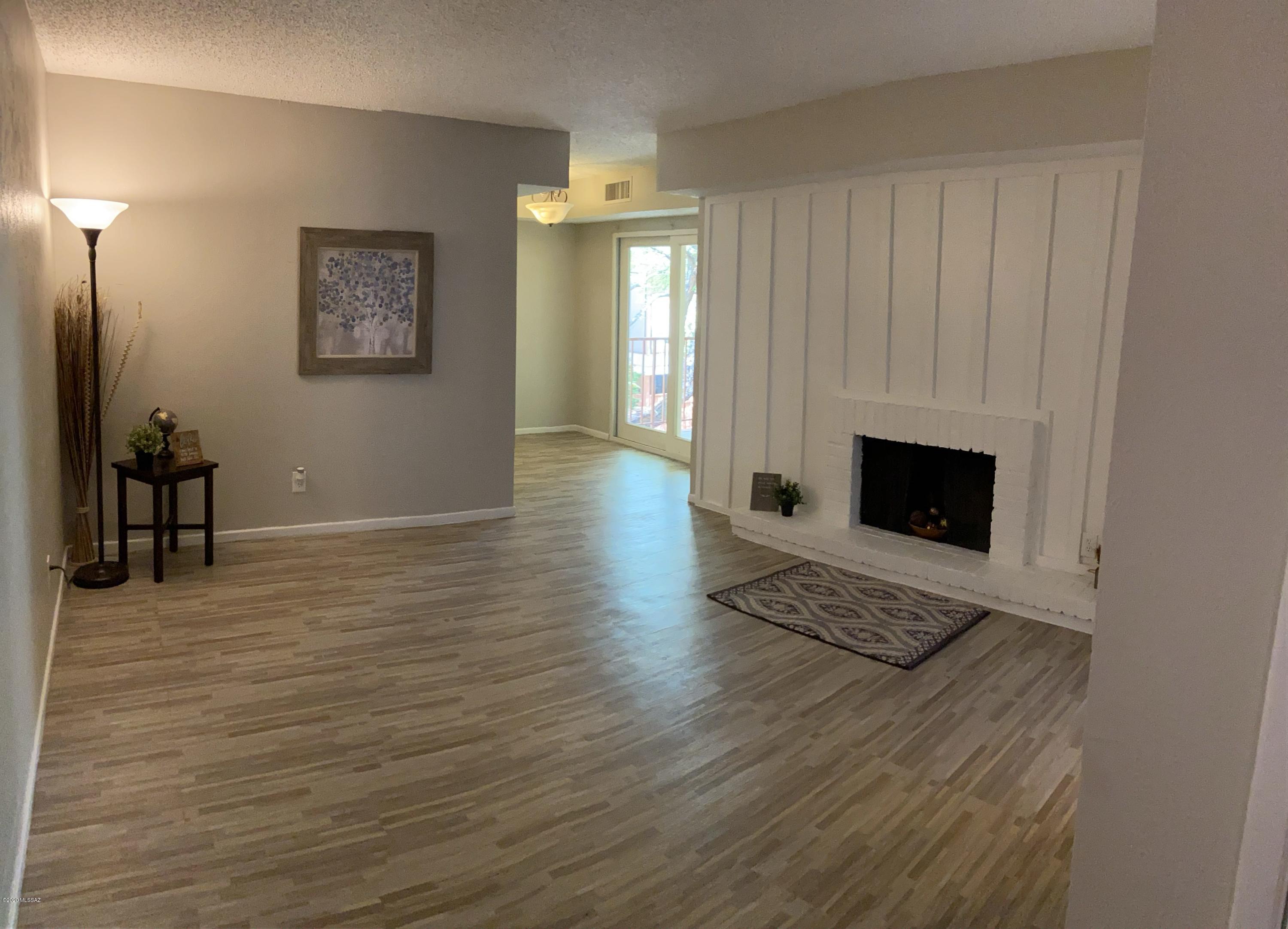 DON'T MISS OUT on this perfect Condo, located only 15 minutes from U of A, and unique dining and shopping right off the bus line.  This gem has 2 large bedrooms, with a walk-in closet and dual closets. Updated private bathrooms Jack and Jill style, including brand new vanities, mirrors and lights. Living Room has a cozy fireplace and dining room accesses to darling patio area over looking beautiful foliage and fruit trees. Patio is also accessible from Master bedroom. The BEST part is, it is MOVE IN READY with New Flooring and Fresh Paint throughout!!  This quiet community is committed to a peaceful enjoyable living!
On location are 2 pools and 3 laundry facilities.  Perfect for the 1st time home buyer, snowbirds or anyone tired of paying rent!!