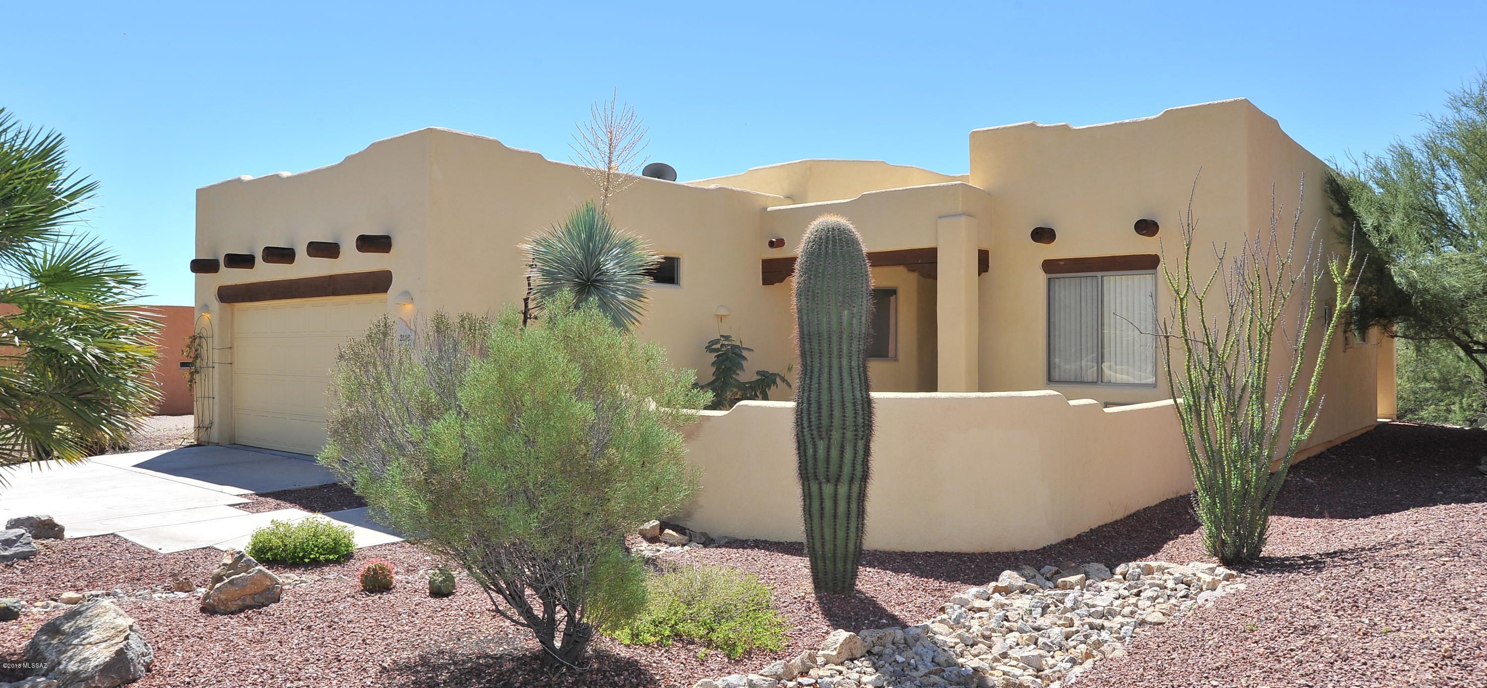Amazing mountain views & tons of community amenities! Enjoy the pool & spa, tennis, basketball, volleyball, bocce ball, pickle ball, recreation center & kitchen facilities for gatherings! PLUS enjoy hiking or biking amongst these majestic mountains right from your property! Truly a special place to call home. Full length covered patio in back opening to natural desert & common area, plus a wonderful courtyard to enjoy additional views! This 1 story features high ceilings, wall of windows, an open foyer, dining & living room w/a cozy beehive fireplace & niches throughout to display art work! Huge kitchen with new stainless appliances including 5 burner gas stove, built-in microwave & dishwasher ~ Great mountain views from the kitchen window, lots of counter space & an abundance of