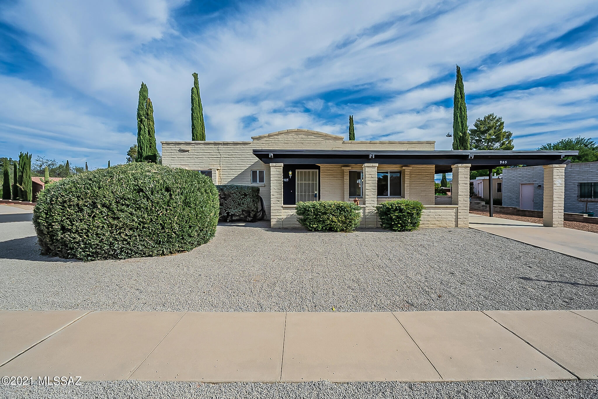 This beautiful brick home is ideally located at the end of the block and away from the noise of the highway. With tile throughout, it has updated showers and counters, refurbished cabinetry, new door handles and light fixtures, and fresh paint inside and out. Enjoy serene Green Valley days and nights in the Sun Room! Brand new AC in April of 2021! Roof has been serviced and comes with a 3 year warranty. Come see and fall in love with your next home!