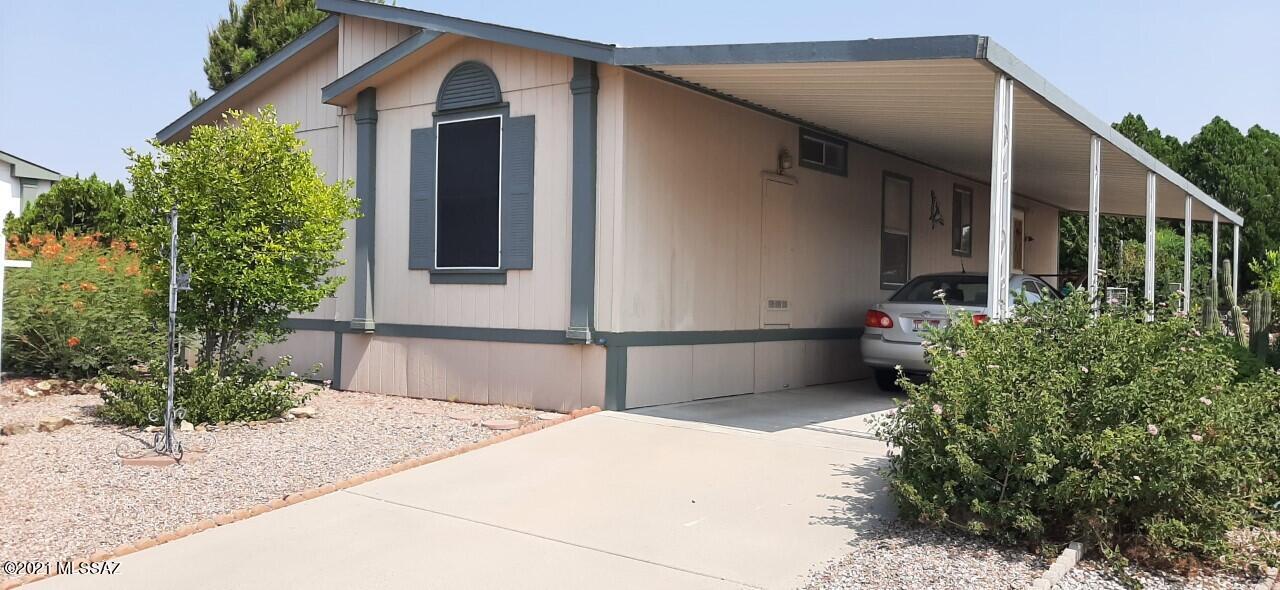 Beautiful home on a corner lot with 2 br and 2 ba. Split floor plan. The extra room could easily be converted to a third bedroom. The kitchen features gas stove, breakfast bar and a lot of storage.  The neighborhood is well maintained with a large swimming pool, heated during the colder months.   Great opportunity to live in an age restricted community that is close to shopping and  restaurants. UPGRADES  include New skirting, New water line from main to house. 
Recent exterior wall and trim paint.
Wiring and plumbing installed for future water feature or fountain.
Upgraded two zone drip system.
Interior walls, ceiling recently painted
New mstr/ba sink and faucet.
Lg master bedroom with walk in closet.
Shower by second BD is designed w/senior in mind, grab bars, low entry. New Carp
