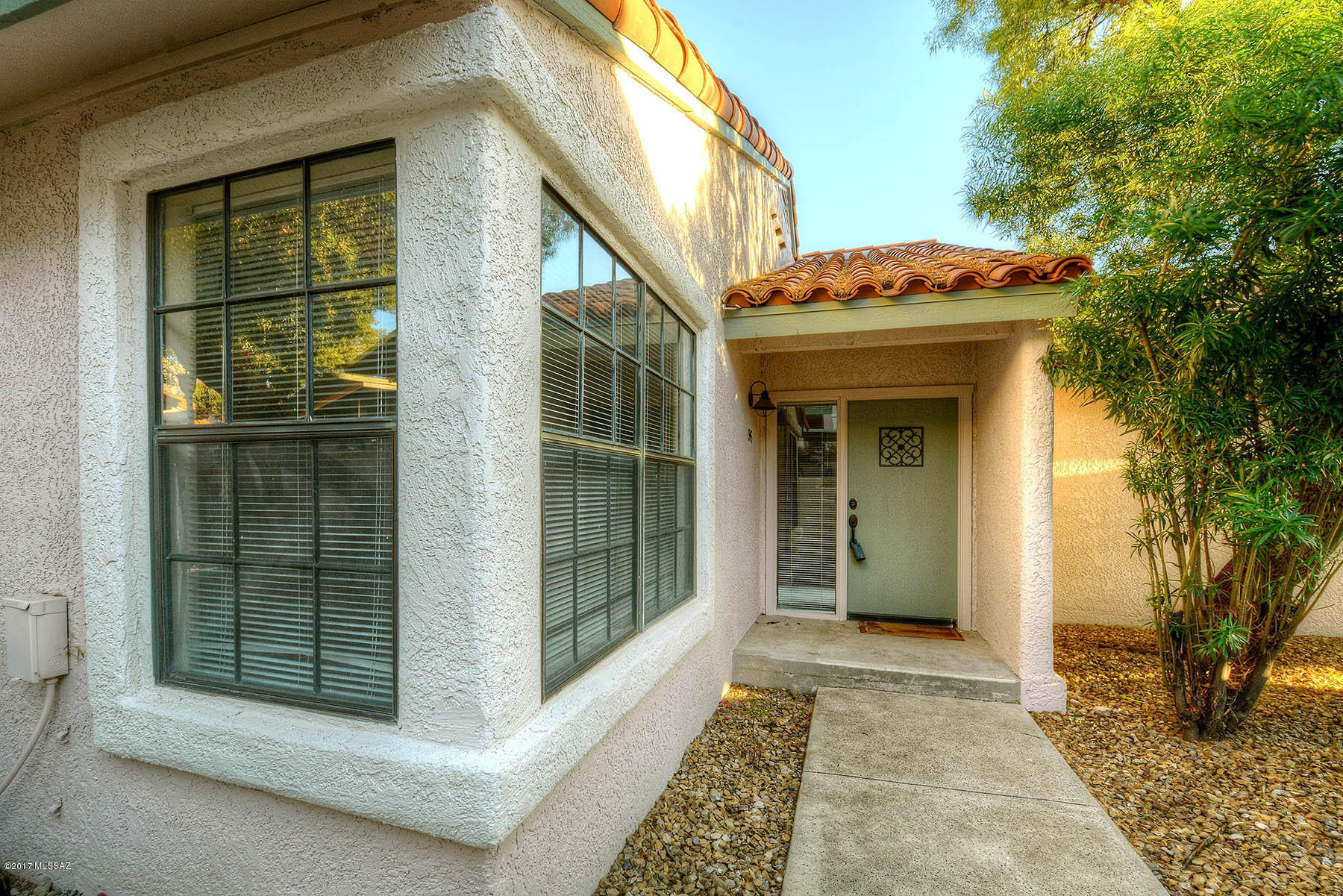 Beautiful unit in prime location, quietly far away from the road, lovely quiet covered porch, mountain views, no interior steps, newer a/c & hot water heater, brand new lovely carpet, bright, cheerful & so well cared for - in great condition. Affordable, easy care Foothills living. So close to La Encantada shopping, restaurants, hiking & biking path with beautiful community pool & tennis courts.  Don't miss it!