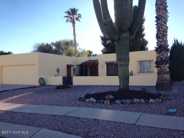 Golf course and mountain views from this spacious home in The Green Valley Country Club on the 8th fairway. Two wood burning fireplaces, a wet bar, front and back patios for your entertaining, and did I mention the AZ room, which is heated and cooled for your comfort. Both bedrooms are very large and both come with walk in closets. A very well maintained home. New roof coat 2016, exterior painted 2016, replaced screens 2016, new indoor outdoor carpet in AZ room and entry way 2017, new garbage disposal 2016, new carpet in guest room 2017, new tile in both bathrooms 2017 and much more. A must see!