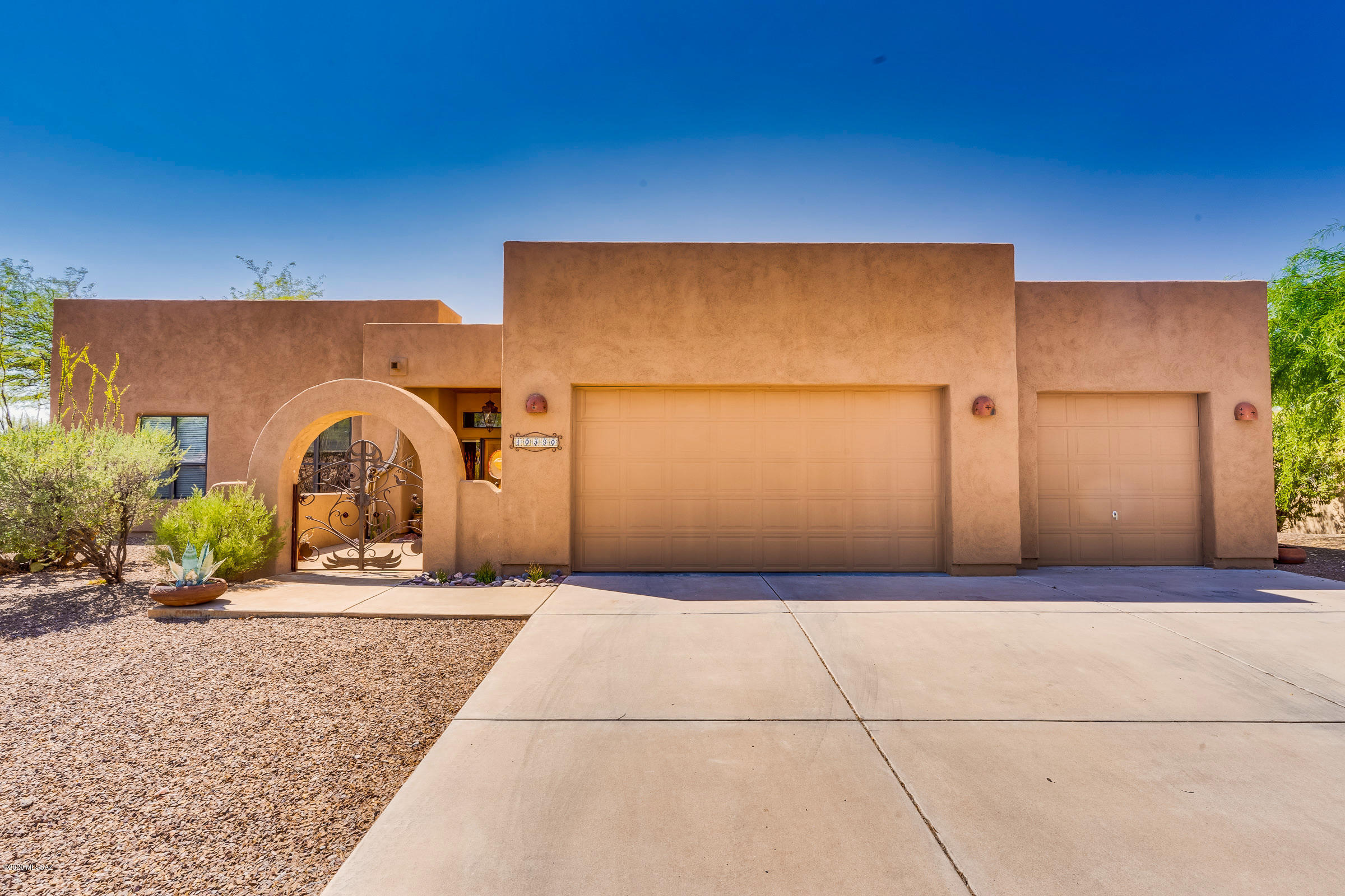 **Range Priced** Seller will accept or counter offers from $390,000 to $399,000.*** Beautiful custom home on corner lot. This home offers space for everyone with a split floor plan. Open kitchen with island and new appliances, formal dining area, large great room with beehive fireplace. Owners Suite includes generous walk-in closet, garden tub, and walk-in shower.  Adjoining the Owner Suite is a cozy den with brick flooring, fireplace, tiled window seat and access to both patios. Three car garage offer's plenty of space for all your toy's. Third stall has been converted to a separate room that can be used as a private home office, School Room,  Exercise room or ''Man cave''! Minutes from Davis Monthan AFB, easy access to I-10 and close to shopping and much more.
