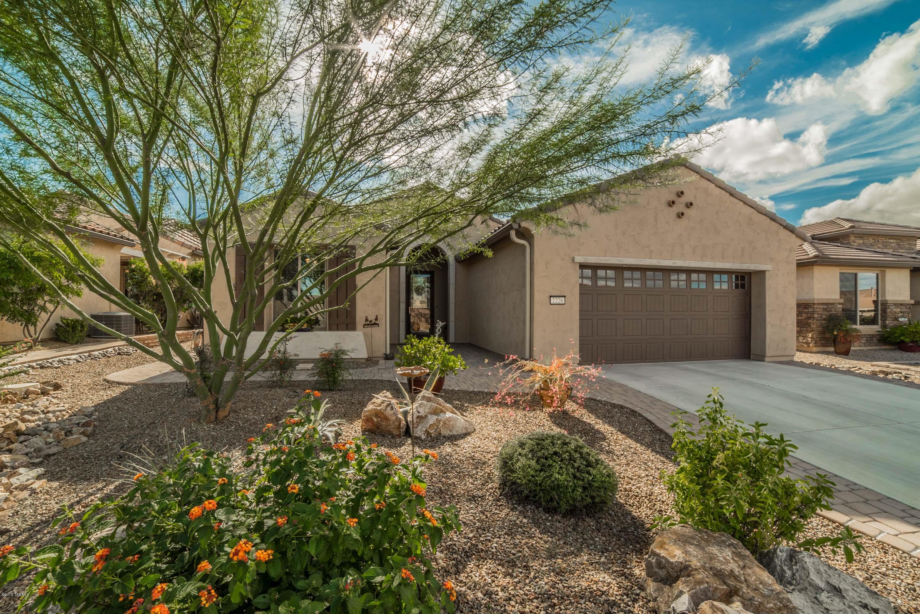 This Fiesta model is one of the more popular models currently being built. This home looks like new and has all those extras done; lighting, window coverings, water softener, epoxy garage floor and especially the landscaping and walls. You will love the granite counters, upgraded cabinetry. stainless appliances, gas range, the hot water re-circulating pump, doors to the den, the wood look tile in the den plus the 2' dining area extension and Bay window in the Master Bedroom. This home is located in a wonderful neighborhood and backs to an arroyo giving privacy and separation from your neighbors. This is a great home and ready to move. Watch the virtual tour for even more detail.