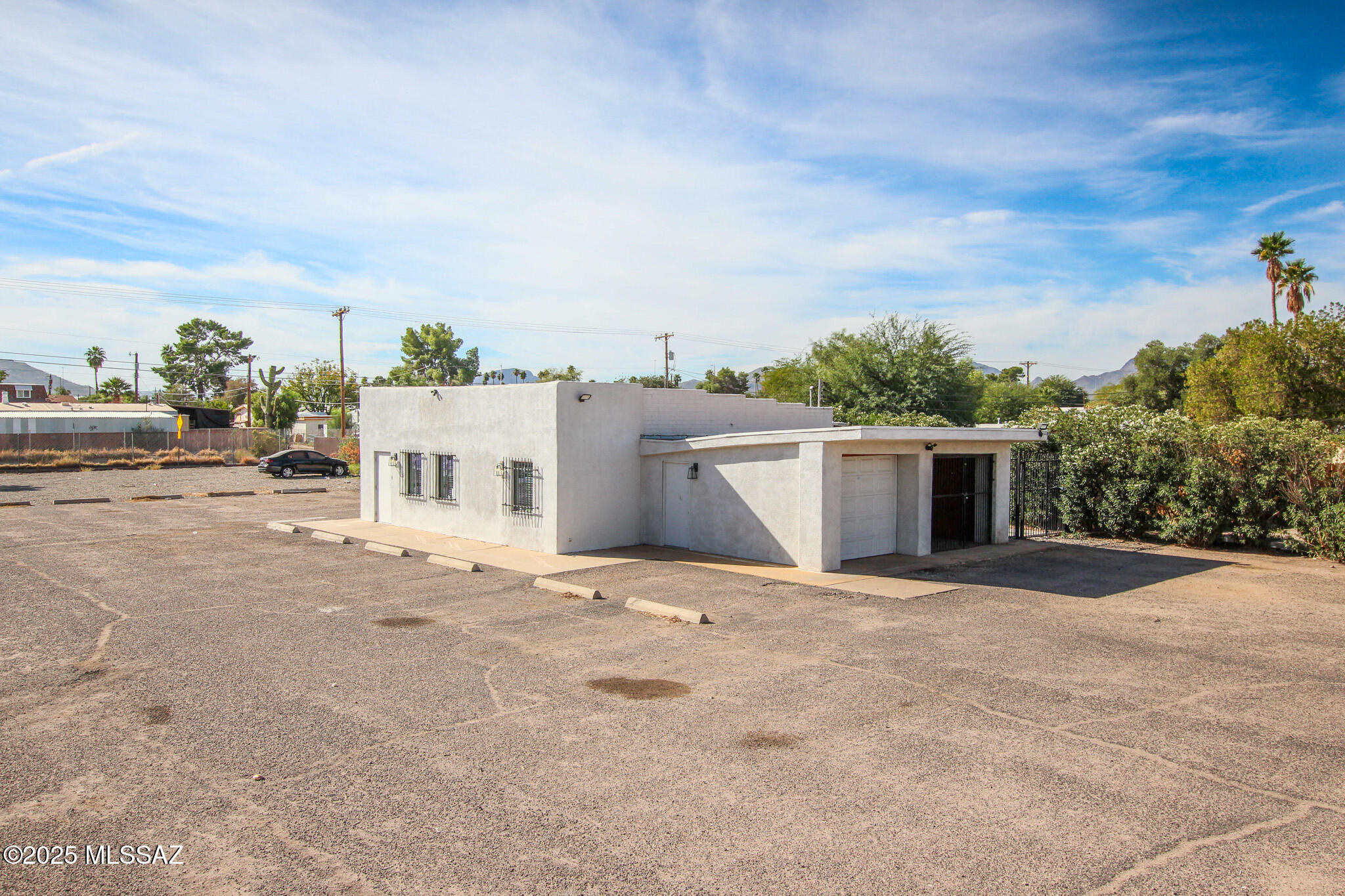 Prime C-1 zoned commercial lot with easy I-10 access. Makes for a great car lot!! was used for the last 5 years as a car lot. Huge lot!! The property includes a main building
featuring four private offices, a lobby, and a restroom, plus a one-car garage and carport. Versatile setup ideal for small
business, office, or service use. Sets on Major rd with lots of traffic. Room to add onto building or add another building. Many uses for this great location. Buildig was remodeled  6 years ago.  Owner/Agent.