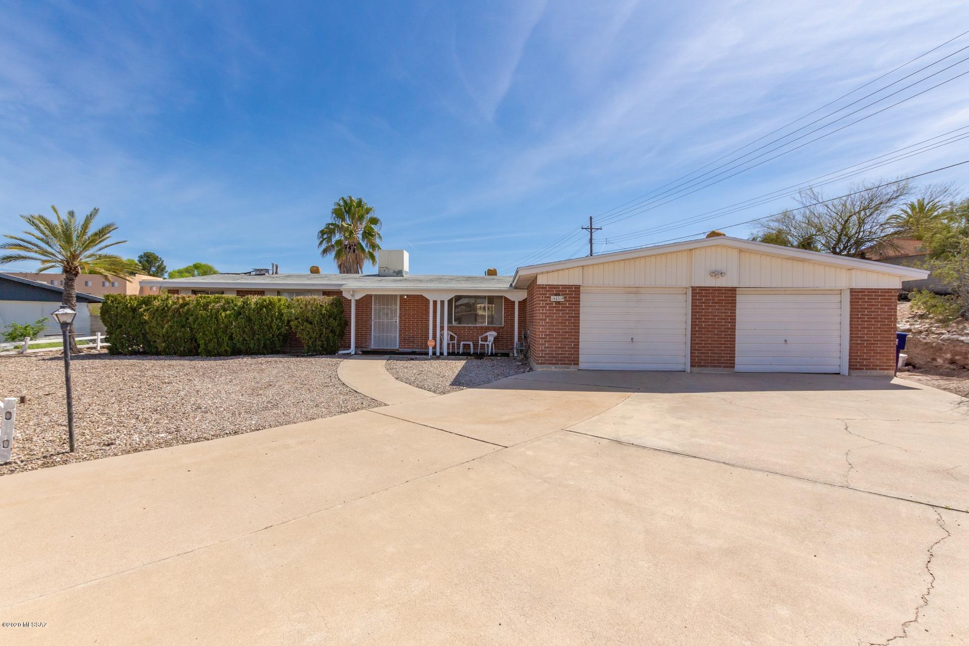 Classic east side home sits on the
largest lot in Huntington Park in a
private cul-de-sac tucked away in this
quaint neighborhood.  Largest lot with .6 acres and a sparkling swimming pool. Retro kitchen with window seating adds a nice touch to this classic house. Extra-large family room addition has a beautiful brick fireplace.  Large OVER-SIZED garage has tons of built-in storage that allows plenty of space for both your tools and vehicles.  Back yard offers mountain views, covered patio with pavers and easy-care landscape.