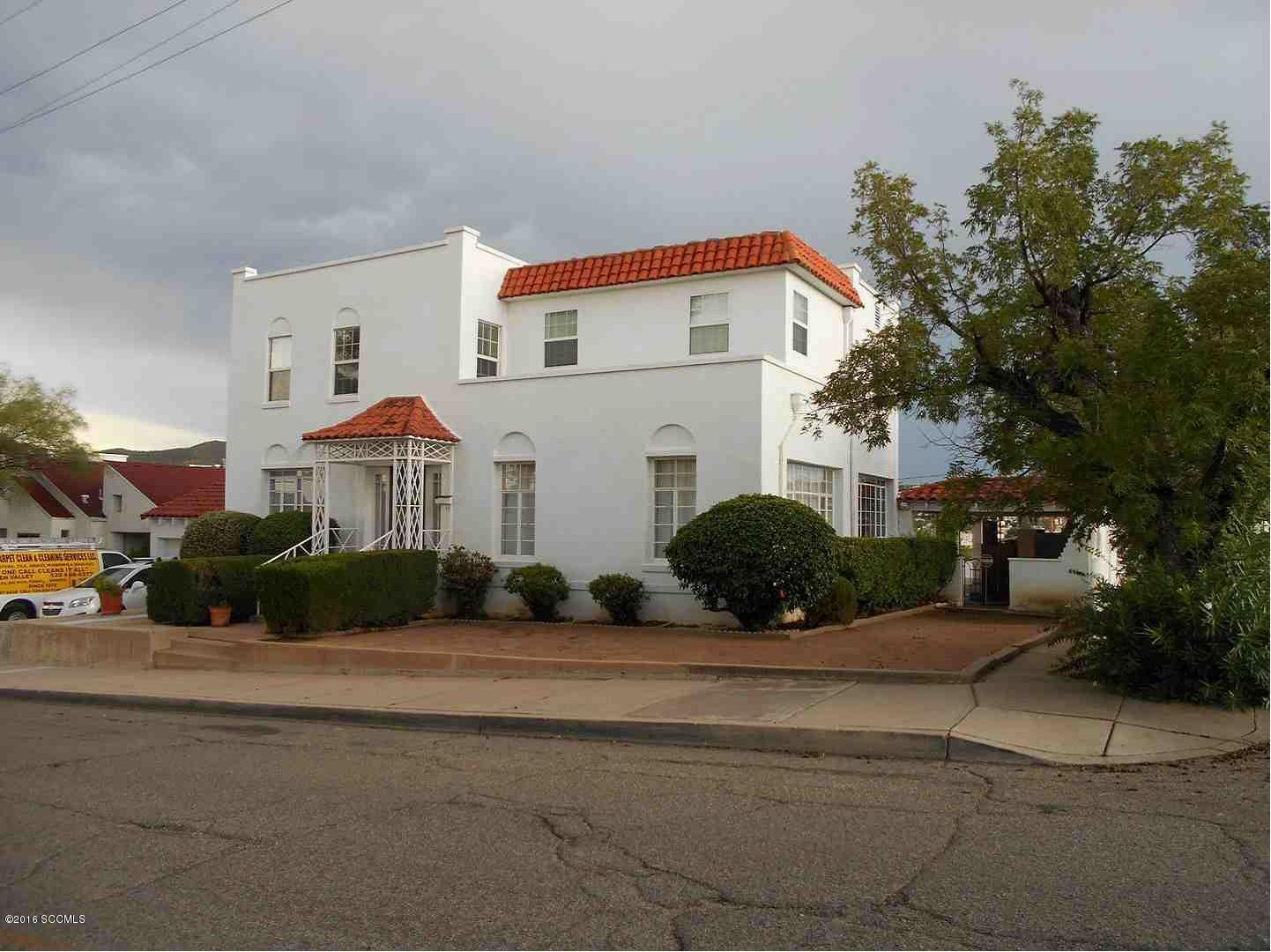 An exquisite home in downtown Nogales!!![] Has beautiful porches, ramada, mature landscaping, expanded garage storage... It's a quality construction home with good design and construction.....totally walled in on a spacious lot w/ amazing views !!!