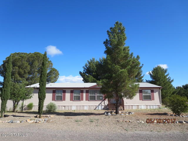 Nice 3 bedroom 2 bath 1920 sq. ft. Manufactured Home on corner lot in Mescal. Spacious open floor plan with an eat in kitchen with lots of cabinets, breakfast bar, a dining area off the great room, a separate den/office plus you can enjoy the shady back yard from the private covered back porch. Easy commute to Tucson or 10 minute drive to Benson for shopping, schools and medical services.