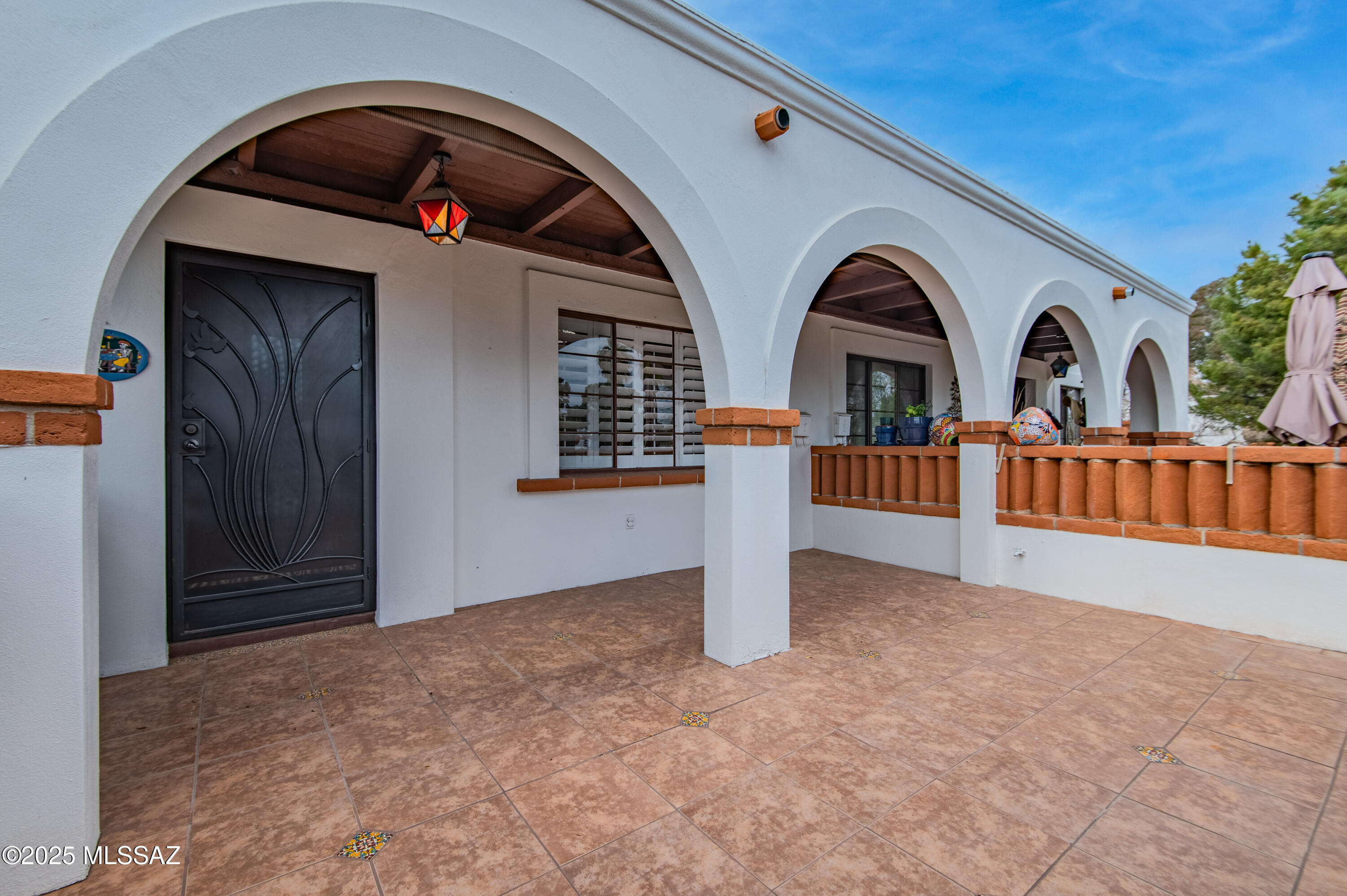 Absolutely charming! Featuring modern new: HVAC/thermostat, roof, hot water tank, shutters, decorative security doors, bedroom flooring, and fresh paint inside & out. Custom mesquite bathroom cabinets w/copper sink & ADA toilet. Elevated patio & hedge provide privacy yet steps from the community pool & laundry. Walking distance to shopping, dining, & Walgreens. HOA covers: exterior paint, HVAC, hot water heater, roof, landscaping, pest control, water/sewer, street maintenance, pool, laundry, parking, and bi-weekly garbage collection. Attached shed in back for extra storage or install a W/D hookup. Conventional loan available w/25% down. Move-in ready & low maintenance!