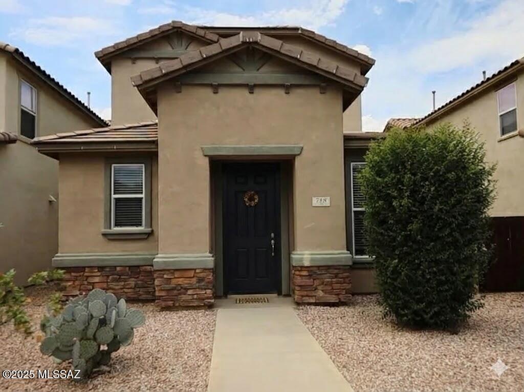 Move-in ready in Rancho Sahuarita! This immaculate 3-bed, 2.5-bath contemporary home offers total peace of mind with major updates: fresh interior paint, updated central HVAC, new carpet, and a water softener. 
The open great room features soaring ceilings and natural light. The modern kitchen boasts stainless steel ENERGY STAR appliances, a breakfast bar, and a pantry. Upstairs includes a convenient laundry room and a primary suite with a double vanity. 
Unwind in a private, low-maintenance backyard with a covered patio and firepit. Enjoy premium resort amenities: a fitness center, splash parks, pools, and a lake. HOA covers front yard upkeep for maximum weekend freedom. Clean, vacant, and ready for you!