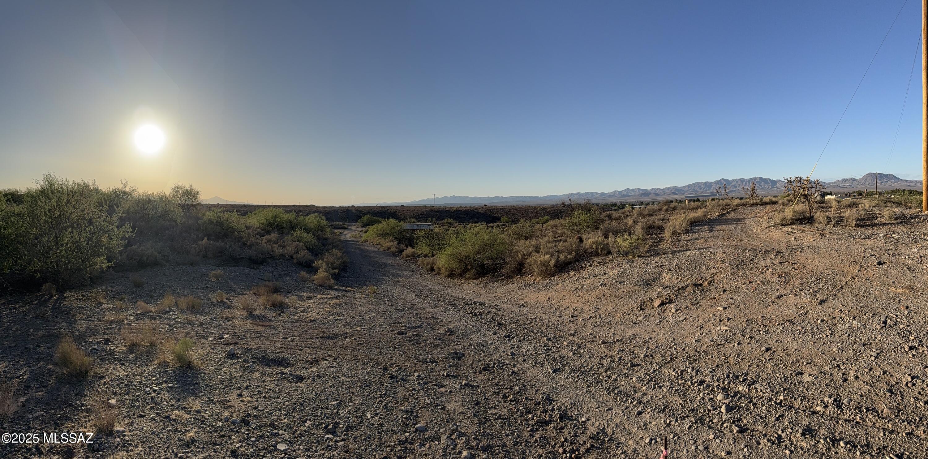 This 9.71 acres is in a great location, very close to Thatcher City ball fields, park, pickleball, and walking and bike paths. Beautiful sunsets and views of Mt. Graham can be enjoyed here. Additionally, a natural spring is located on the northwest side of the property, which flows well, particularly during the monsoon season. Bring your horses and build on this centrally located property. Electric service is available on the lot line, while water and sewer services are situated on Reay Lane, and a septic system is also available.