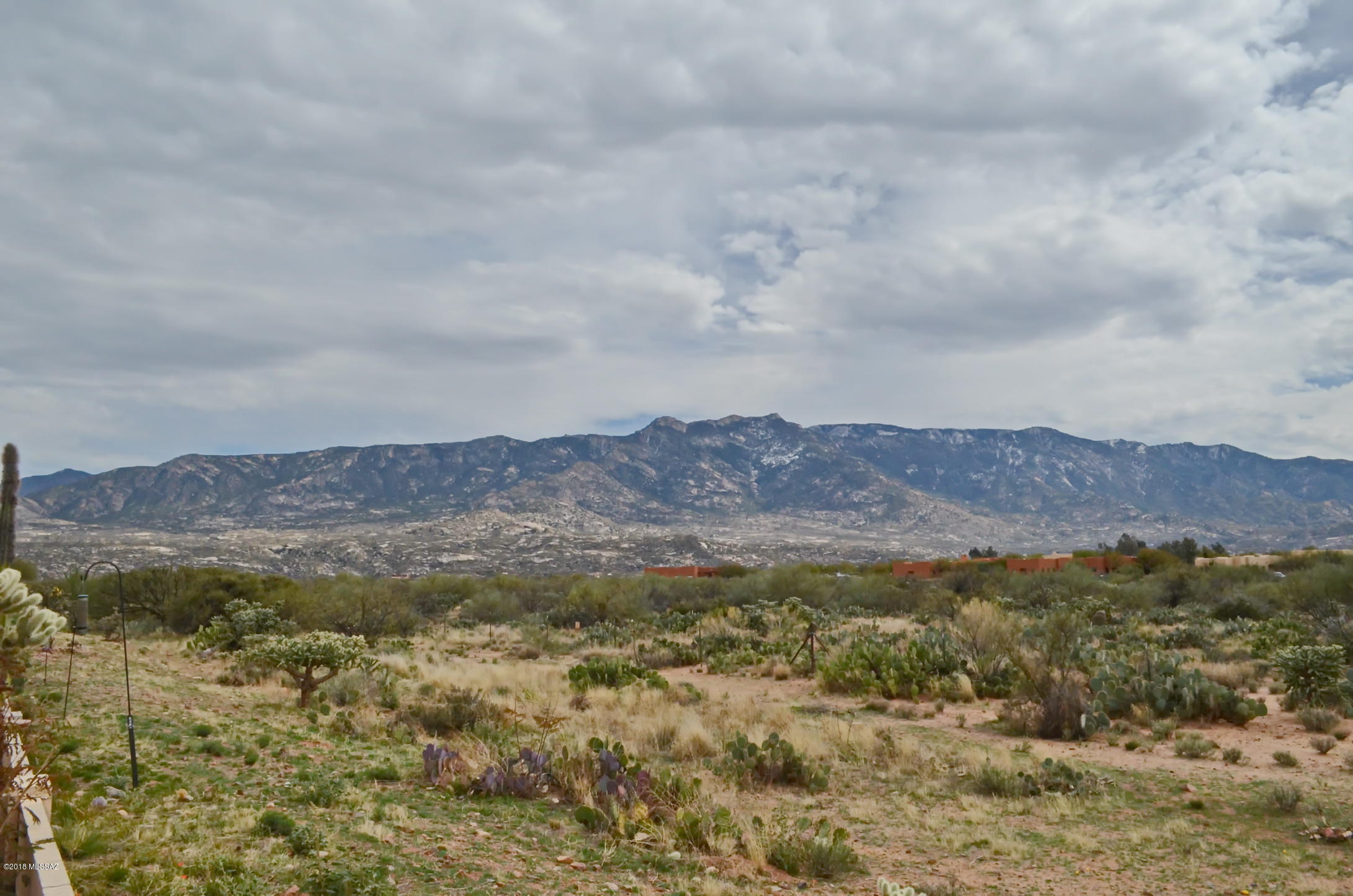 Unbelievable Mountain Views from this one owner home. This Ponderosa Model will not disappoint. The home hosts a large kitchen with center island, cherry cabinets, corian counter-tops, double singks, desk and pullouts in the cabinets. Kitchen nook with Bay window, laundry room with cabinets and utility sink, family room with built in entertainment center, living room, formal dining, guest bedroom, office/den that could be converted into another guest bedroom, spacious master with sitting area, separate shower, walk-in closet, plantation shutters throughout, extended garage and screened in voered patio the length of the home. Tile throughout the home except carpet in bedrooms. This home is immaculate and don't forget the unobstructed panoramic mountain views and to top it all off, the home backs up to common area for privacy. Call for your private showing today!
