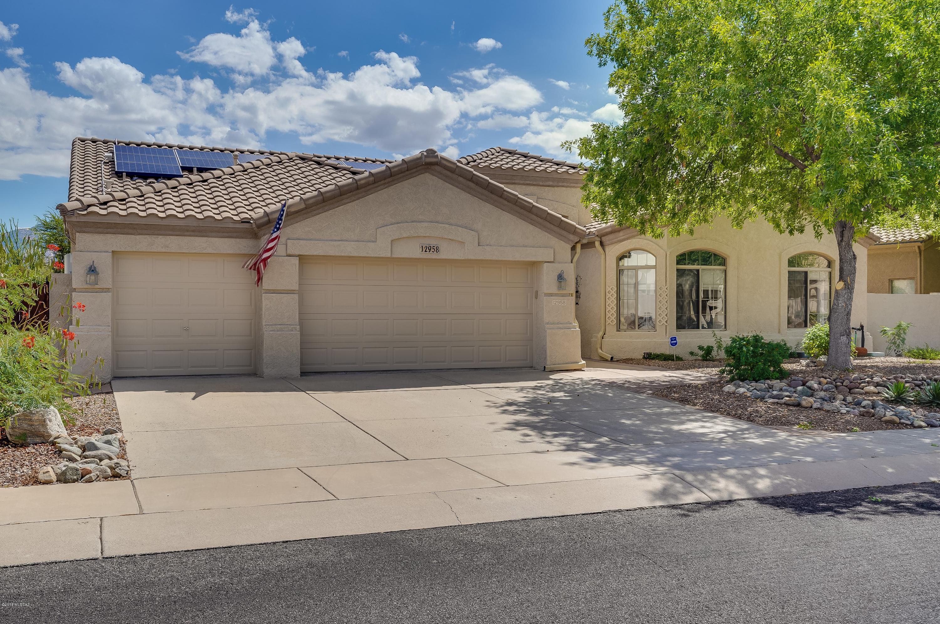 Check out these amazing Catalina Mountain Views from this meticulously maintained Oro Valley Home.  You won't be disappointed with a wonderful split floor plan to its amazing resort style backyard. Generous amount of ceramic tile leads you into 4 bedrooms & 2 full bathrooms.  This move-in condition property just had exterior and some interior paint, updated master bath with custom shower surround.  Newer Efficient  Rheem Prestige AC unit, Enjoy the waterfall as you look at the views over your 1 year old colored plastered pool & jacuzzi.  Custom Aluminum Pergola accompanies the covered patio overlooking your amazing yard.  Solar Panels make your electric very reasonable.  See attached Features list in the Document Tab. Call for you private tour, it won't last