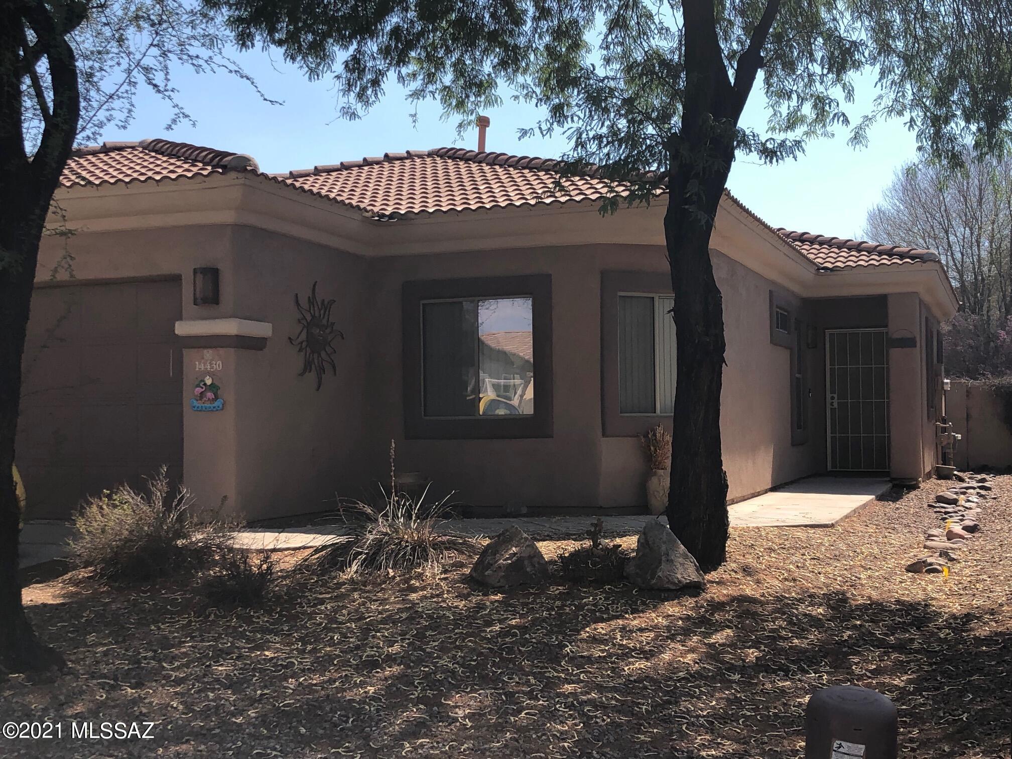 Versatile 4 bedroom, 2 bathroom or 3 bedrooms + den. Great room floor plan with split bedrooms. Tile roof, covered patio. Rancho Sahuarita community with amenities galore: swimming, biking, sport courts, lake and so much more.