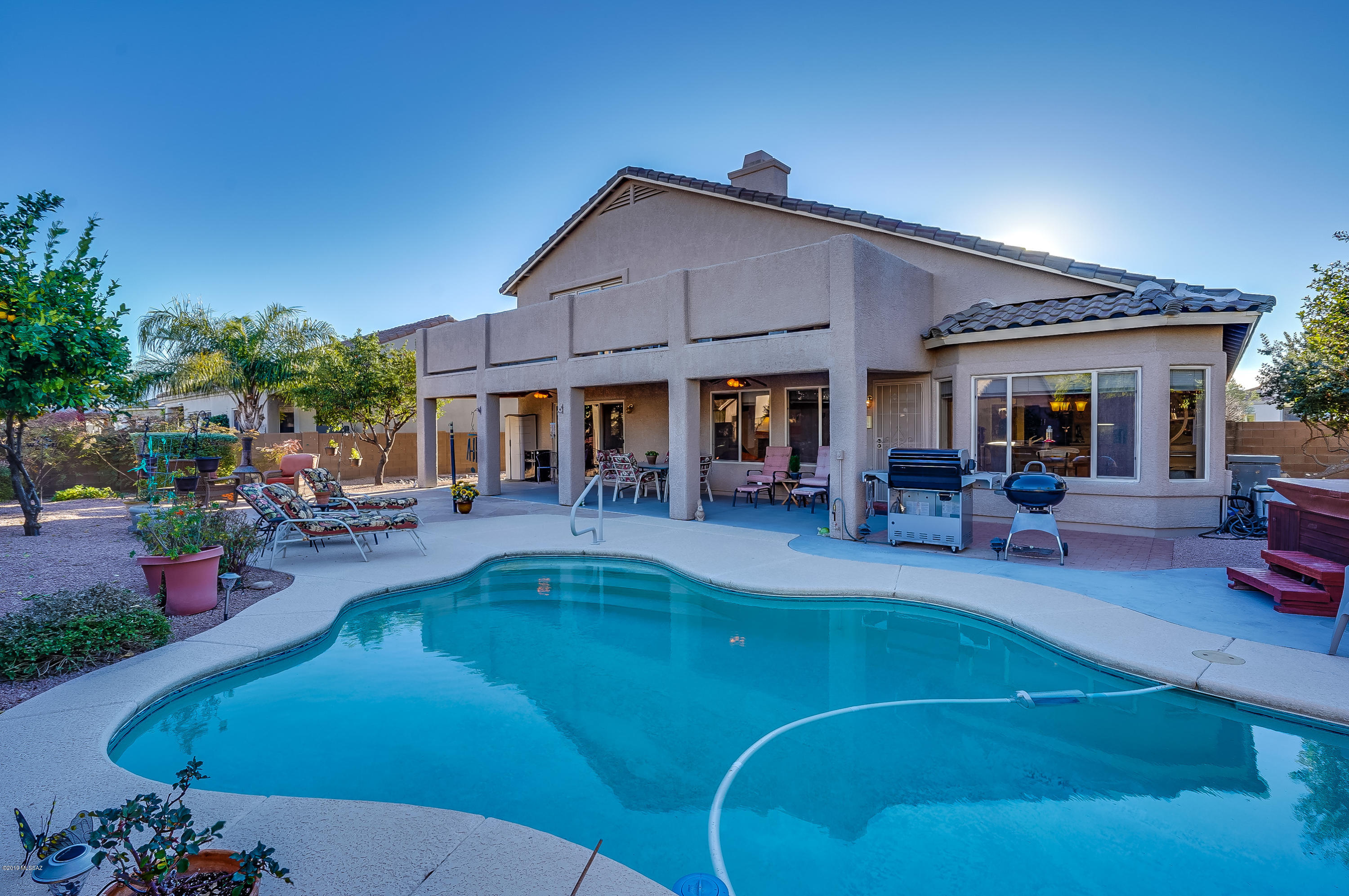 Seller will credit Buyer $2,000 toward Buyer's closing costs at close of escrow with acceptable offer.  Master Suite Downstairs w/jacuzzi tub  & sep shower and His/Hers Closets, Newer Zoned AC & Water Heater, Mountain Views, Pool & Spa, Oversized Deck for Stargazing, Home Office, 3 car extended garage, extra roof insulation.  Great Room w/cozy Fireplace, Breakfast Nook and Island w/Bkfst Bar, upgraded maple cabinets w/under cabinet lighting, Formal Living & Dining & central vac. Great back yard for entertaining, featuring full length covered patio plus extended flagstone patio, mature fruit trees & gorgeous mountain views. When the sun is setting, sit out on the deck & watch the mountains turn shades of pink & purple & then at dark, stargaze.  See list of upgrades attached.