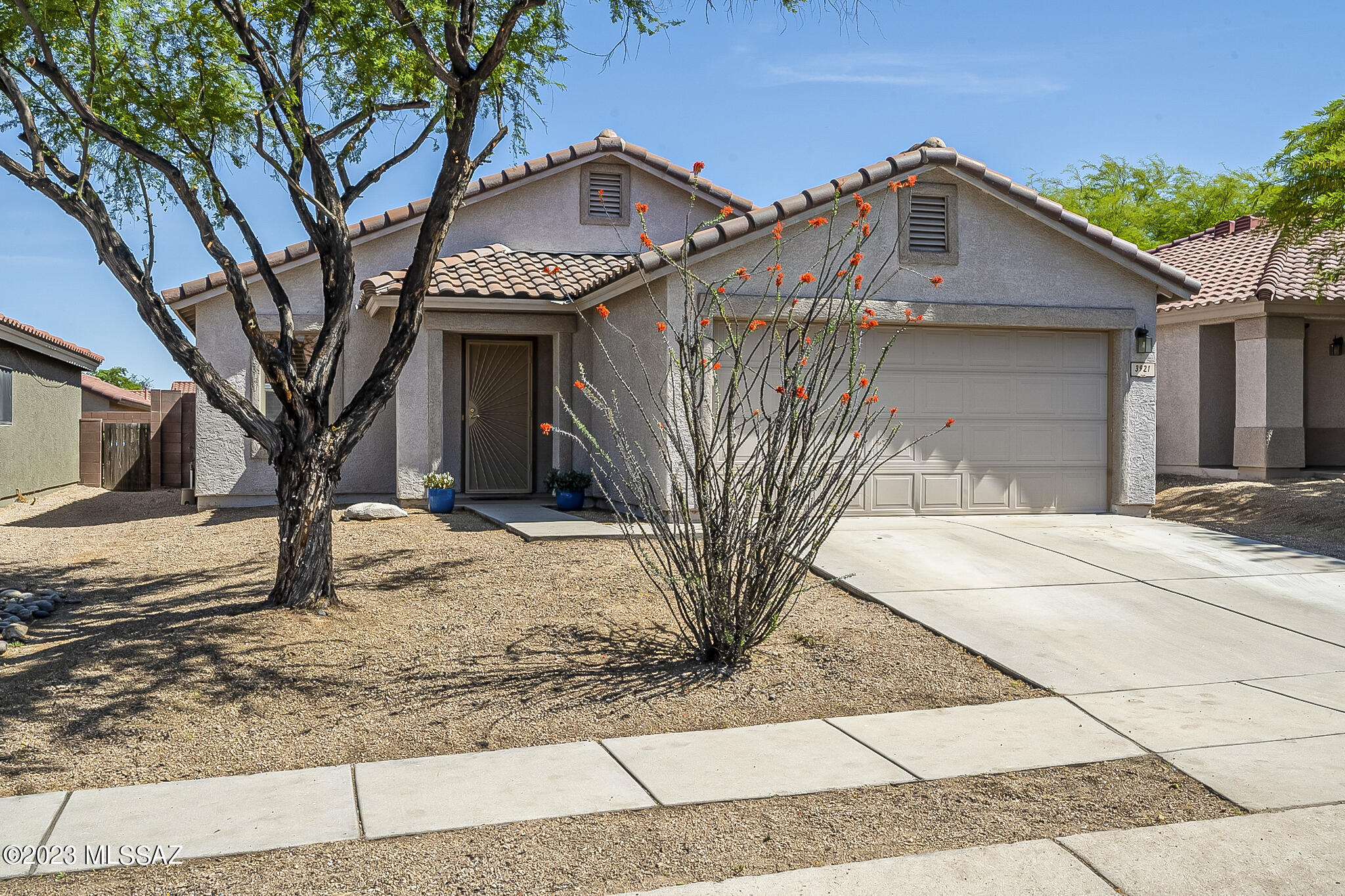 Tranquil setting, convenient location; your search stops here! Charming home with versatile floor plan featuring both Living and Family Rooms. Step in to find a freshly painted interior, attractive neutral tile on the diagonal in all high traffic areas, and new carpet in the bedrooms. Custom built-in desk in Family Room is a great office space. Also features maple kitchen cabinets with crown molding, stainless refrigerator and oven, ceiling fans and convenient kitchen island. Heating and AC replaced in 2019 so you will be cool and comfortable. Relax under the covered patio in private, low care yard. Gated neighborhood has community pool. HOA includes trash, street maintenance, community pool and spa. Convenient location with easy access to I-10 & downtown. A great place to call home!