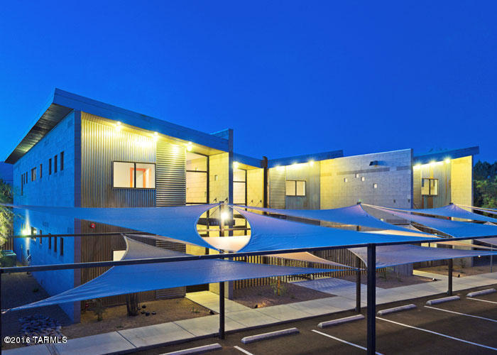Gorgeous Contemporary living at it's finest.  An Architectural Digest Award Winner! Gated Community, this spacious 3 bdrm/2bath is bright and airy.  One bedroom and full bathroom is downstairs with other 2 bedrooms and bathroom upstairs.  Open, sleek kitchen with all appliances.  Great room with natural lighting, and washer/dryer included.  Private patio with fenced yard.  Designated shaded tenant parking.  Convenient to downtown, U of A,shopping, dining, hospital, and also easy access to I-10.