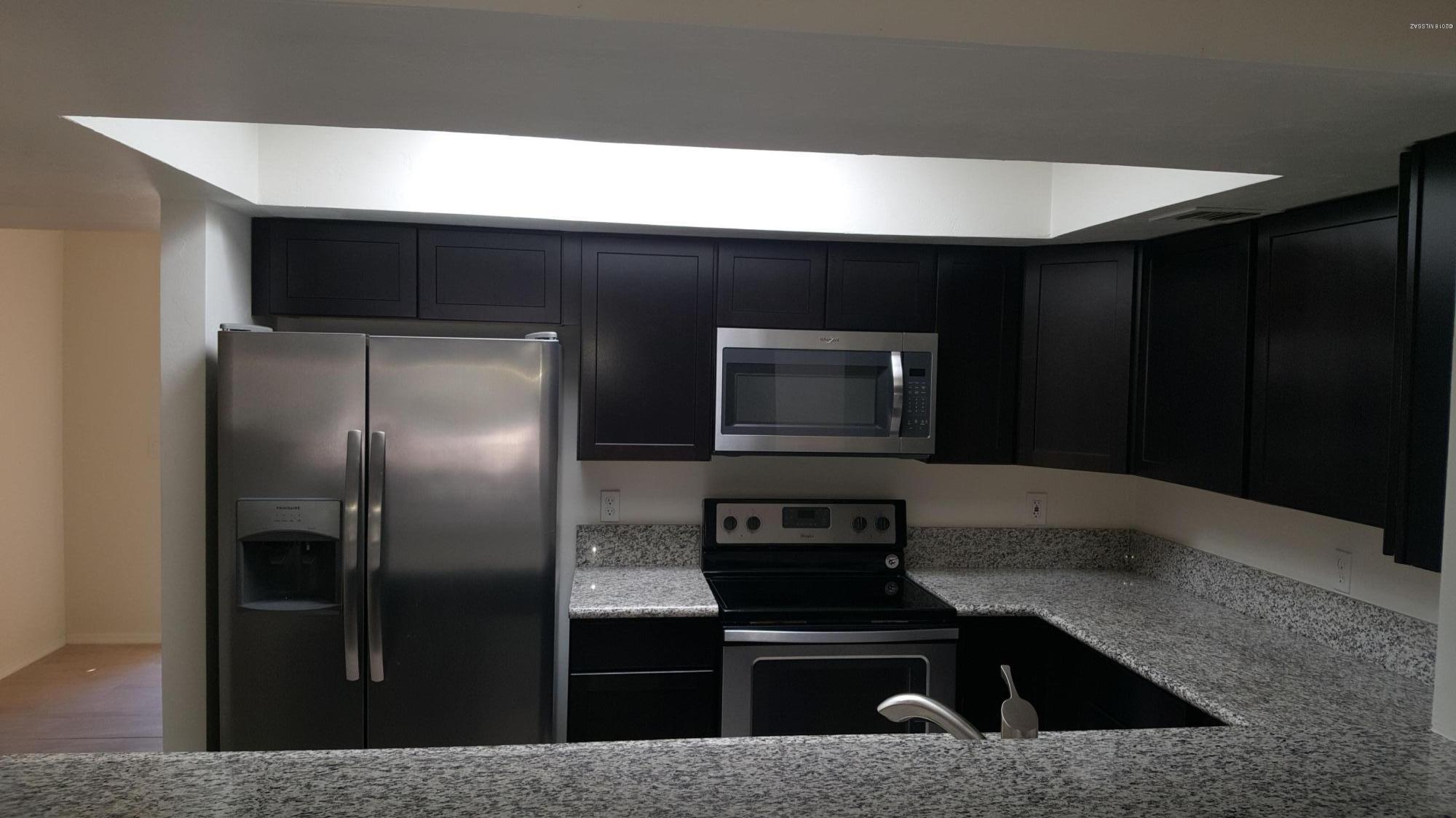 Charming fully remodel townhouse. Close to shopping centers and dinning. Tile throughout townhouse, Tile on both bathrooms walls, granite counter top on kitchen, all kitchen appliance stay microwave, stove, refrigerator, and dishwasher. Ready to move in. This townhouse is a must see!