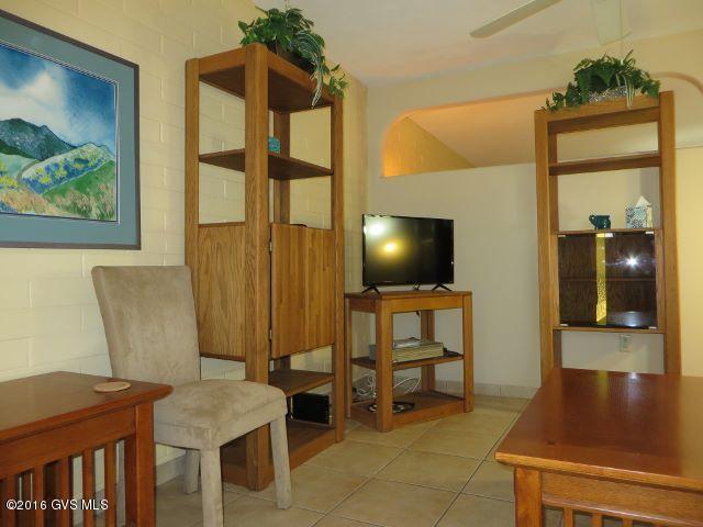 Lovely 1BR/All tile flooring flows through the entire home and entry/Nicely painted blends with Surroundings/Blinds in Kitchen arched window move up or down/Kitchen is furnished, all appliances & some small appliances stay,lighting above & below kitchen cabinets, new garbage disposal works great/LR is Partially furnished with comfortable clean furniture/2 medicine cabinets & shelving in neutral Bath/Ceiling fan in LR to help with cooling/Electric AC & Heating/Water heater is only 3 years old/Entry is fully screened/Washer & dryer tucked in closet easy access to bathroom or bedroom/Patios are a neighborhood gathering place/Owner licensed RE agent in AZ