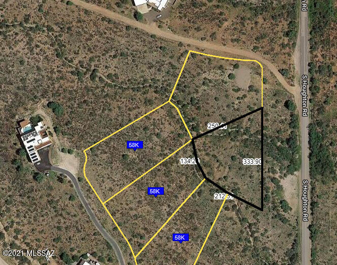 NO HOA! This is the site of your new dream house with valley and mountain. This 1.12 acre lot is located in the Santa Rita Foothills in exclusive Corona de Tucson community. Boarding to the east of this quiet lot is land owned by the State. You'll enjoy the fabulous views and starry nights from the gentle sloping foothills location. Electric is already on lot, you'll just need to bring your building plans and get going. Buyer to independently verify any material facts themselves.